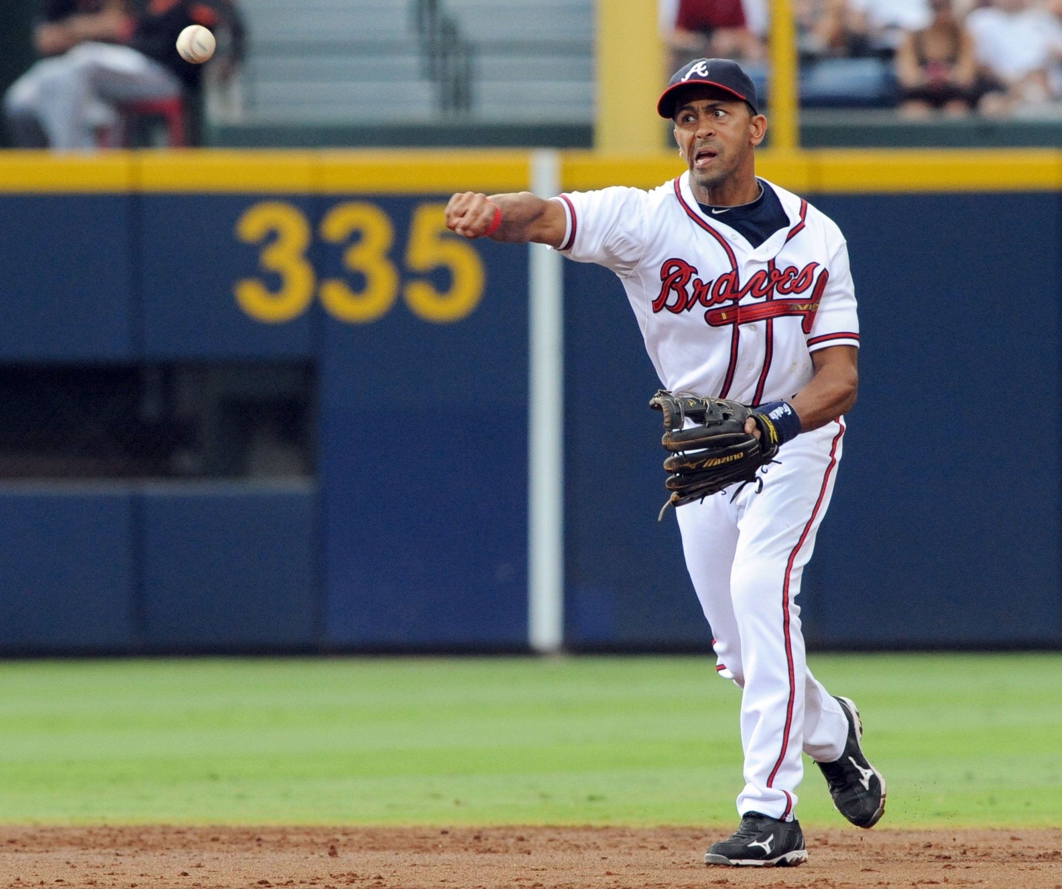 Atlanta Braves' shortstop Julio Lugo throws out a San Francisco Giants player during a baseball game on Wednesday, Aug. 17, 2011, at Turner Field in Atlanta. (AP Photo/Erik S. Lesser)