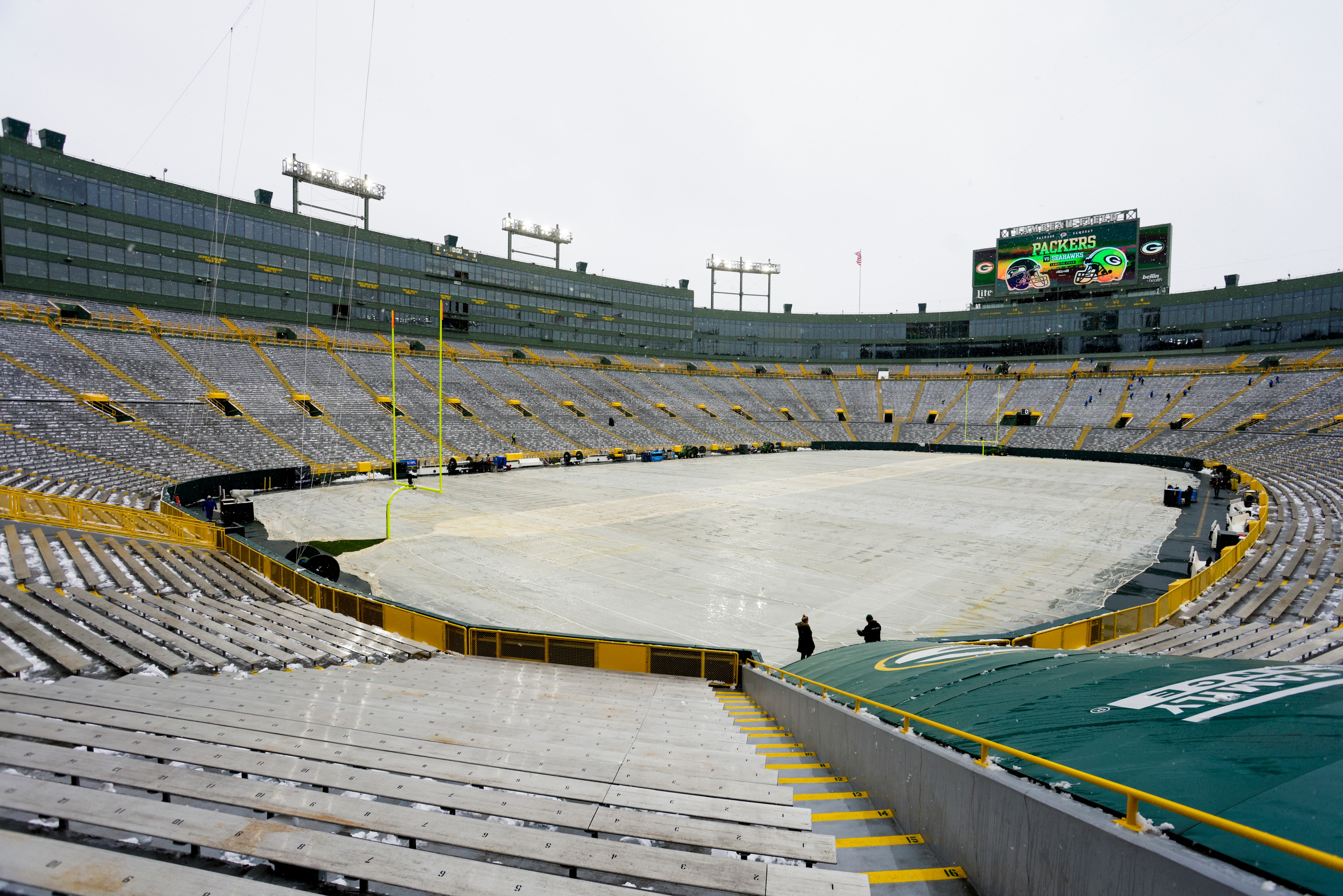Snow is seen at Lambeau Field before an NFL football game between the Green Bay Packers and the Seattle Seahawks Sunday, Nov. 14, 2021, in Green Bay, Wis. (AP Photo/Matt Ludtke)