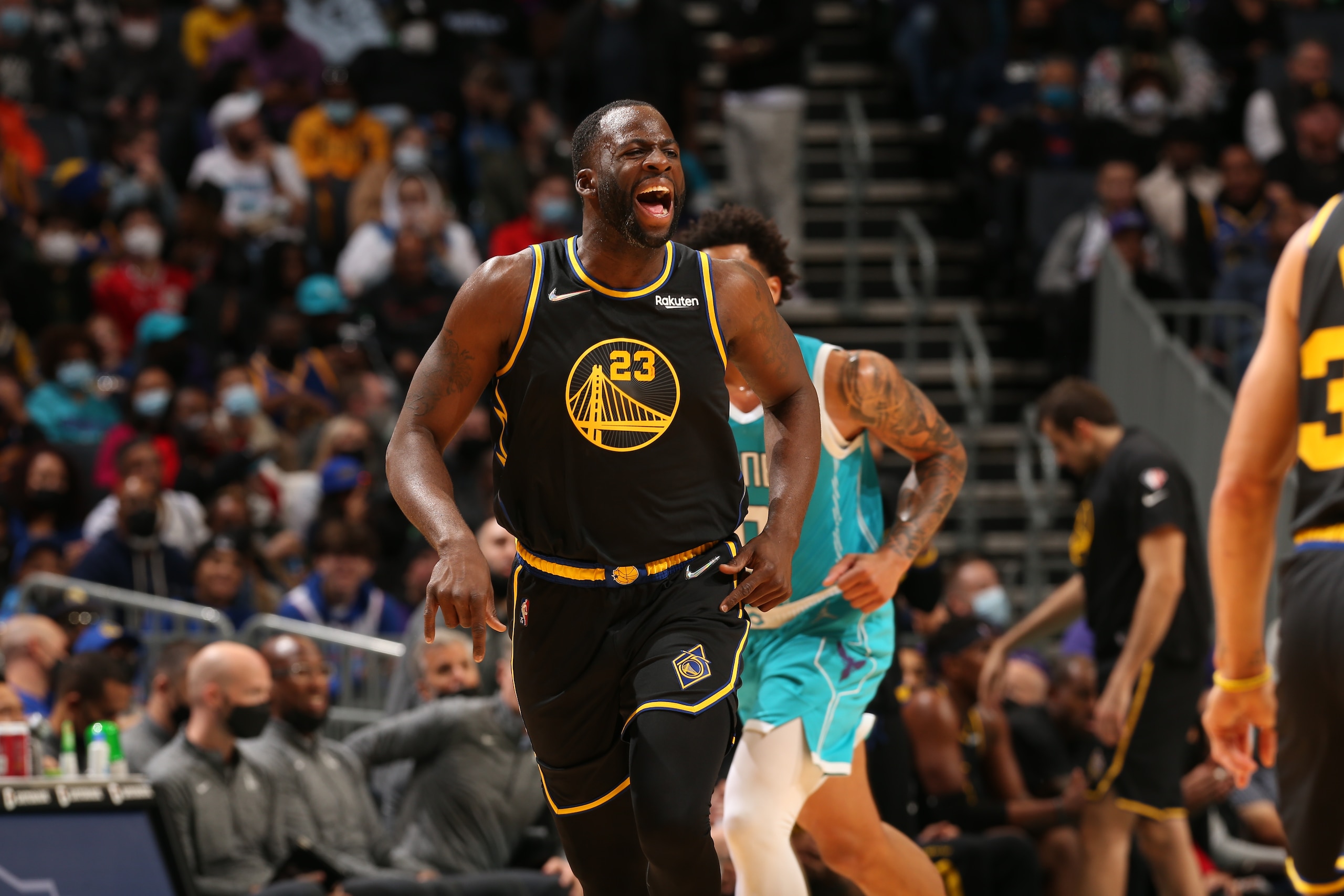 CHARLOTTE, NC - NOVEMBER 14: Draymond Green #23 of the Golden State Warriors celebrates during the game against the Charlotte Hornets on November 14, 2021 at Spectrum Center in Charlotte, North Carolina. NOTE TO USER: User expressly acknowledges and agrees that, by downloading and or using this photograph, User is consenting to the terms and conditions of the Getty Images License Agreement. Mandatory Copyright Notice: Copyright 2021 NBAE (Photo by Kent Smith/NBAE via Getty Images)