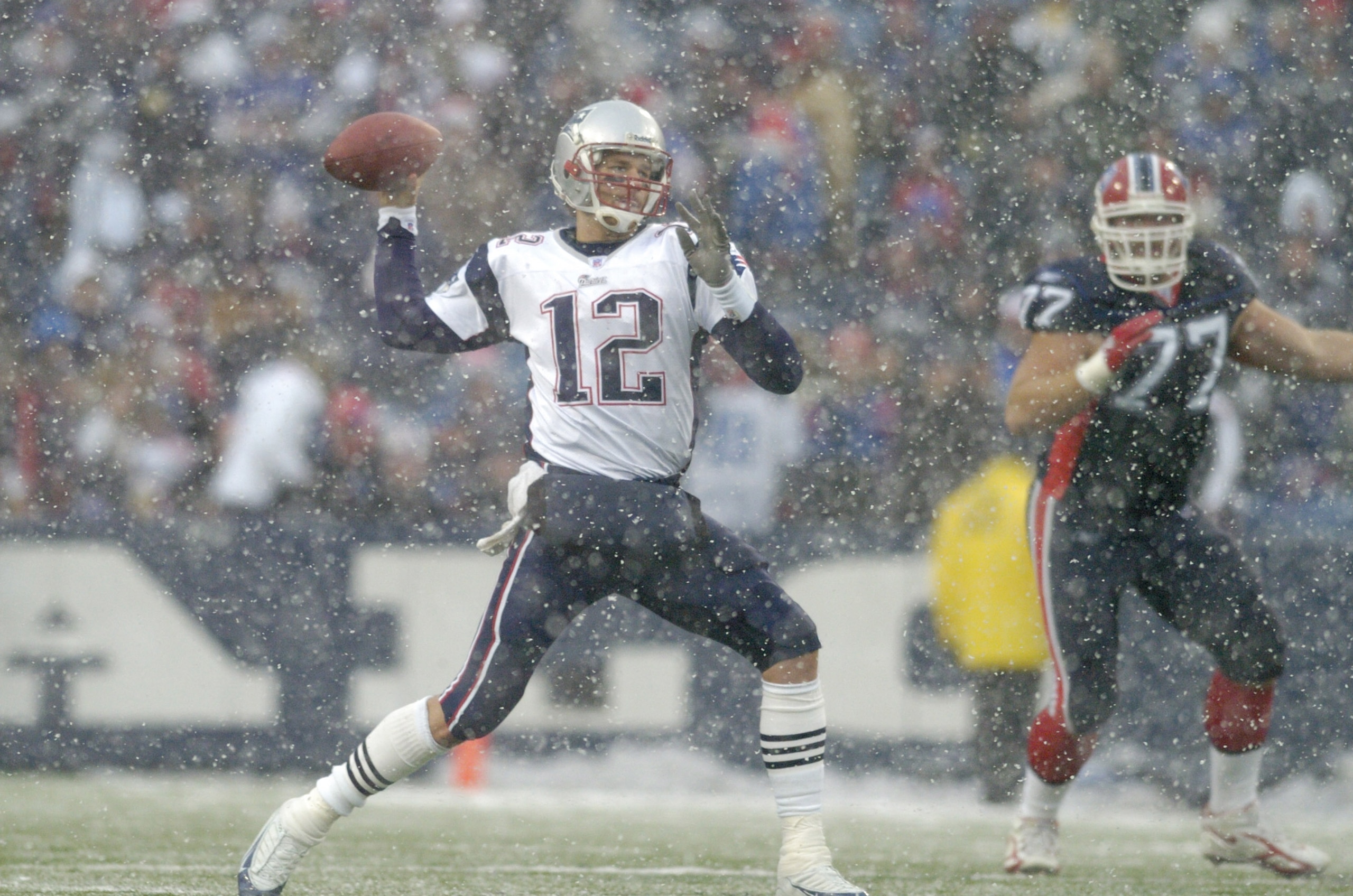 New England Patriots quarterback Tom Brady throws in the snow during a game against the Buffalo Bills at Ralph Wilson Stadium in Orchard Park, New York on December 11, 2005. New England won the game 35-7. (Photo by Mark Konezny/Getty Images) New England Patriots quarterback Tom Brady throws in the snow during a game against the Buffalo Bills at Ralph Wilson Stadium in Orchard Park, New York on December 11, 2005. New England won the game 35-7. (Photo by Mark Konezny/Getty Images)