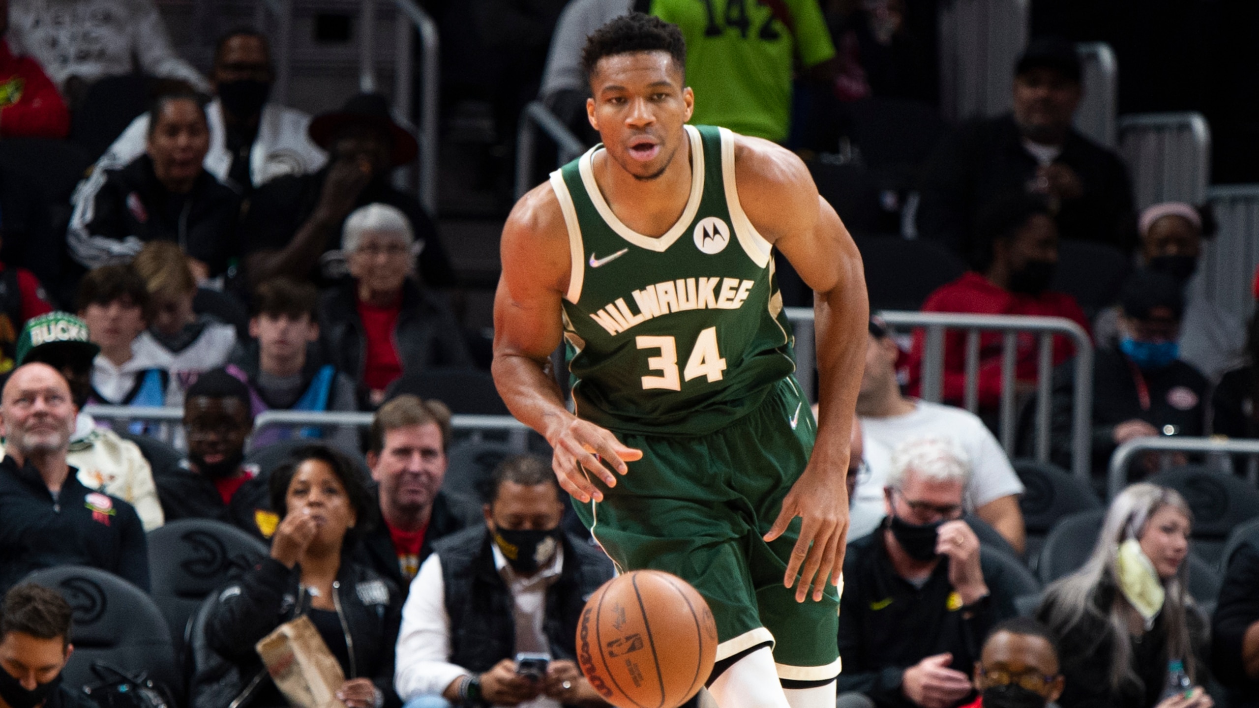 Milwaukee Bucks' Giannis Antetokounmpo (34) dribbles up the court during the first half of an NBA basketball game against the Atlanta Hawks on Sunday, Nov. 14, 2021, in Atlanta. (AP Photo/Hakim Wright Sr.)