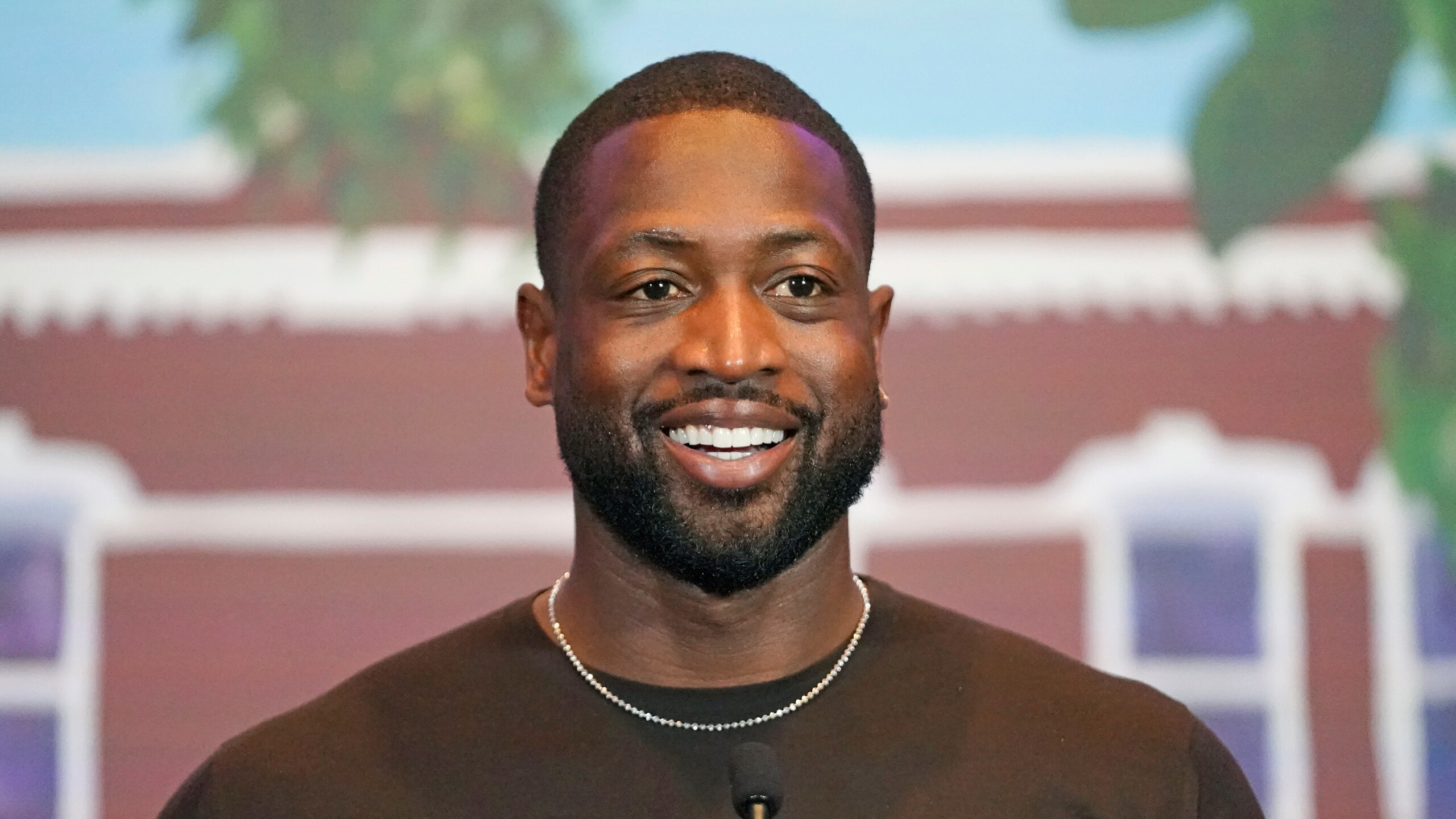 NBA All-Star Dwyane Wade speaks during a news conference Wednesday, Oct. 13, 2021, in Salt Lake City. Apple CEO Tim Cook and Wade joined Utah leaders to announce the completion of a local advocacy group's campaign to build eight new homes for LGBTQ youth in the U.S. West. (AP Photo/Rick Bowmer)