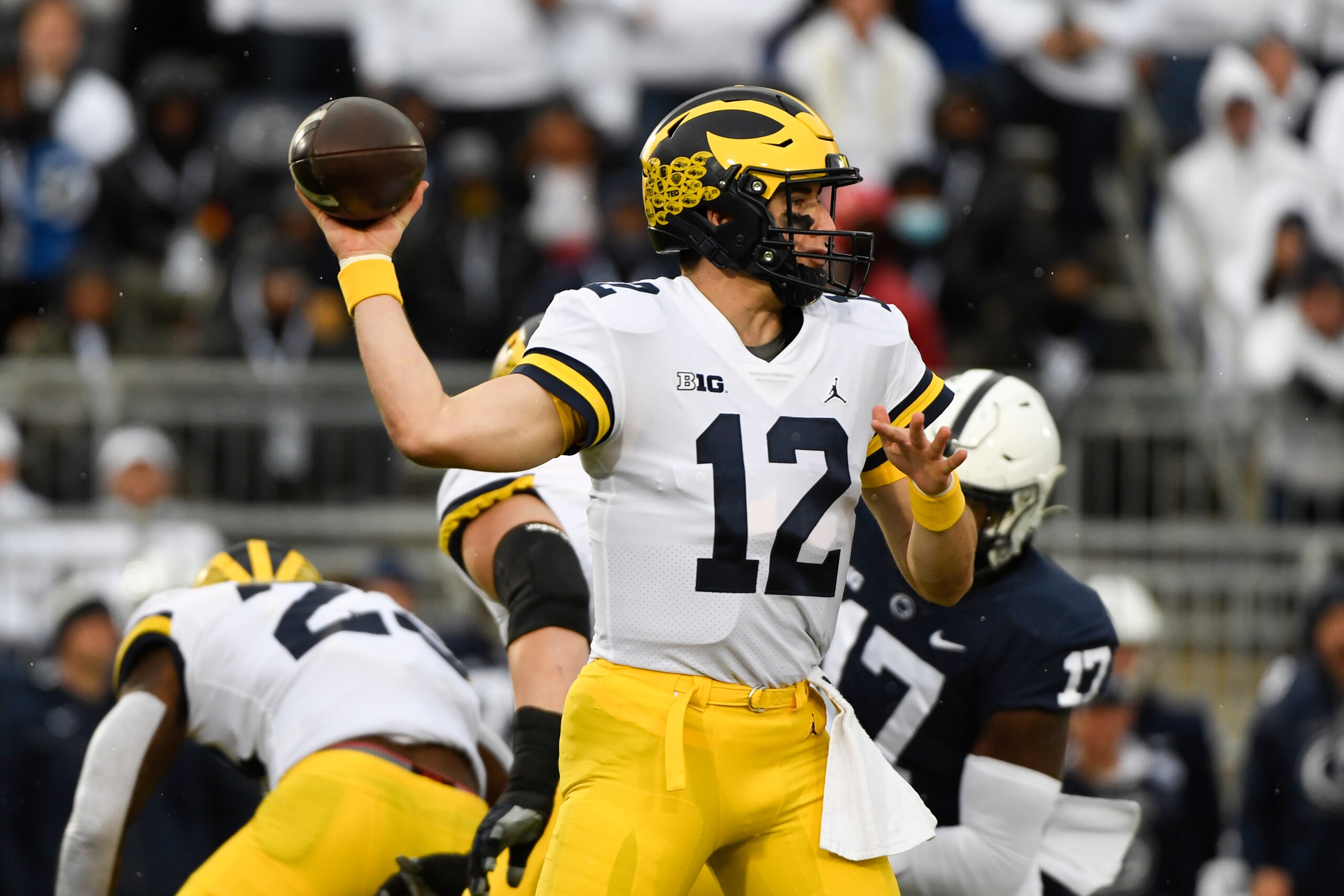 Michigan quarterback Cade McNamara (12) passes against Penn State during an NCAA college football game in State College, Pa., Saturday, Nov. 13, 2021. (AP Photo/Barry Reeger)