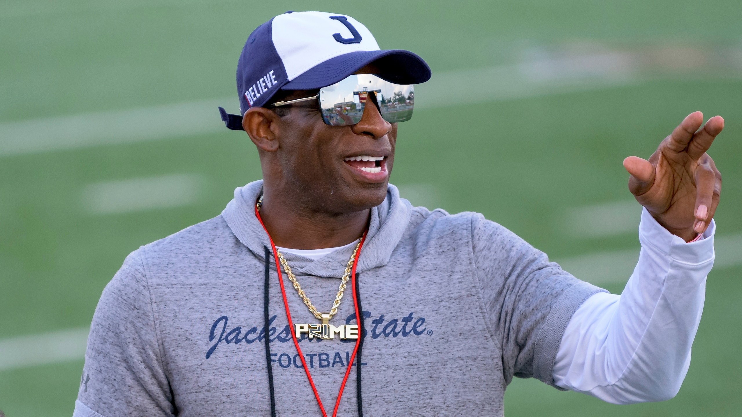 Jackson State head coach Deion Sanders motions to his players during an NCAA football game against Louisiana Monroe on Saturday, Sept. 18, 2021, in Monroe, La. (AP Photo/Matthew Hinton)