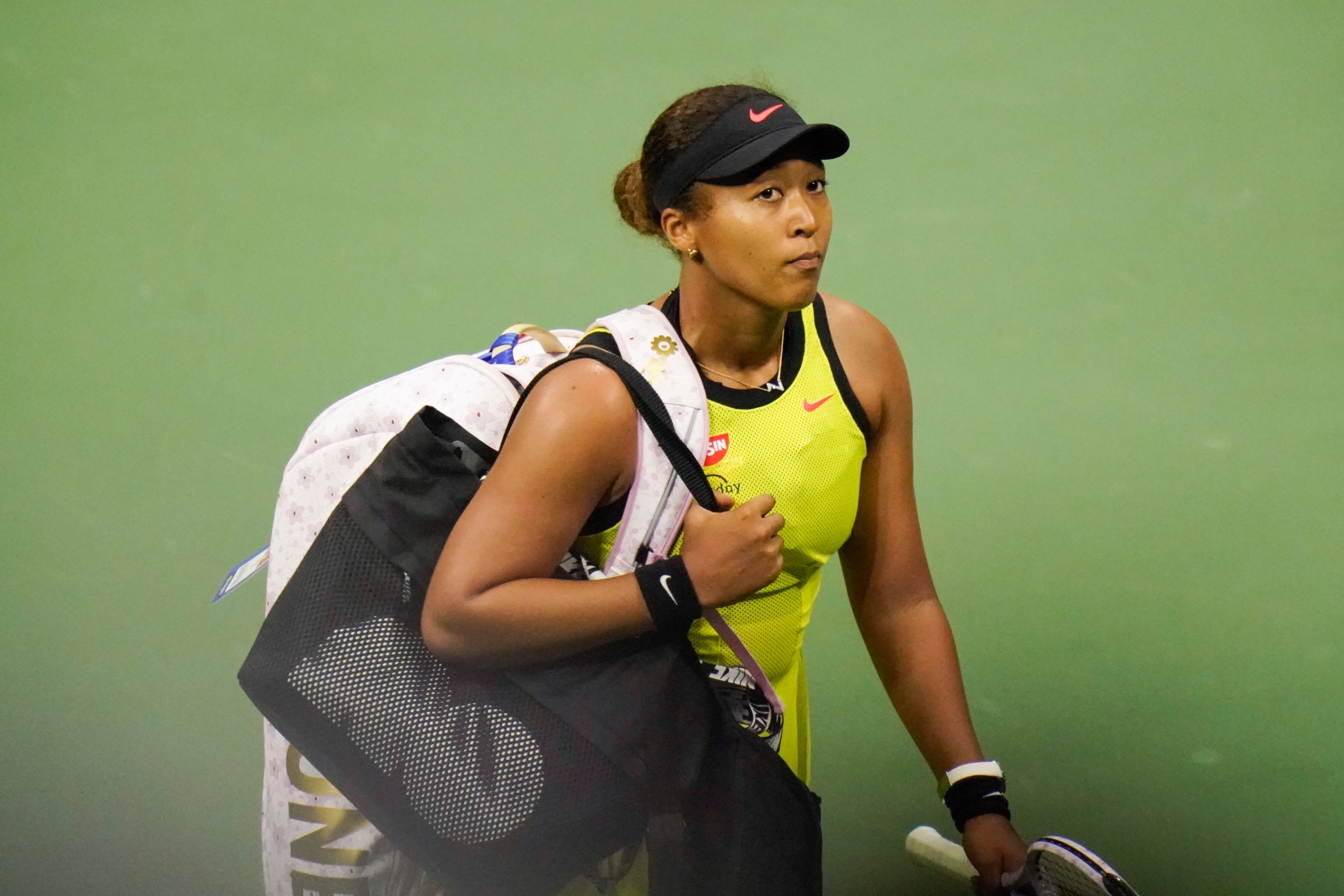 Naomi Osaka, of Japan, leaves the court after losing to Leylah Fernandez, of Canada, during the third round of the US Open tennis championships, Friday, Sept. 3, 2021, in New York. (AP Photo/Frank Franklin II)