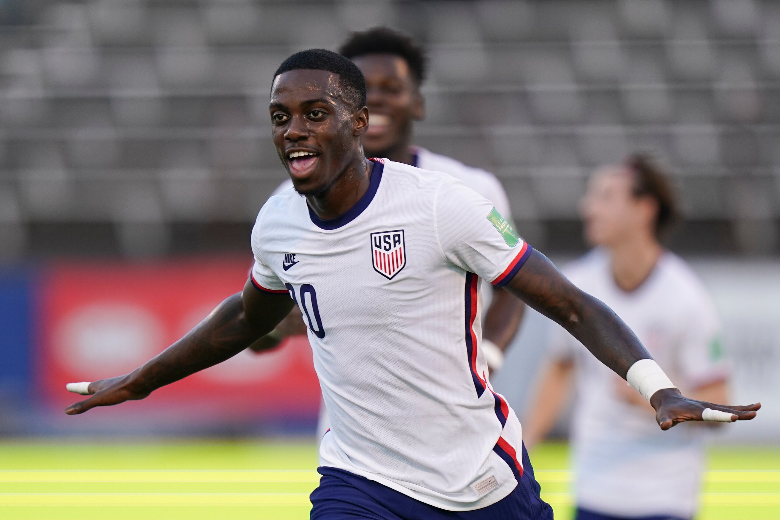 United States' Tim Weah celebrates scoring his side's opening goal against Jamaica during a qualifying soccer match for the FIFA World Cup Qatar 2022 in Kingston, Jamaica, Tuesday, Nov. 16, 2021. (AP Photo/Fernando Llano)
