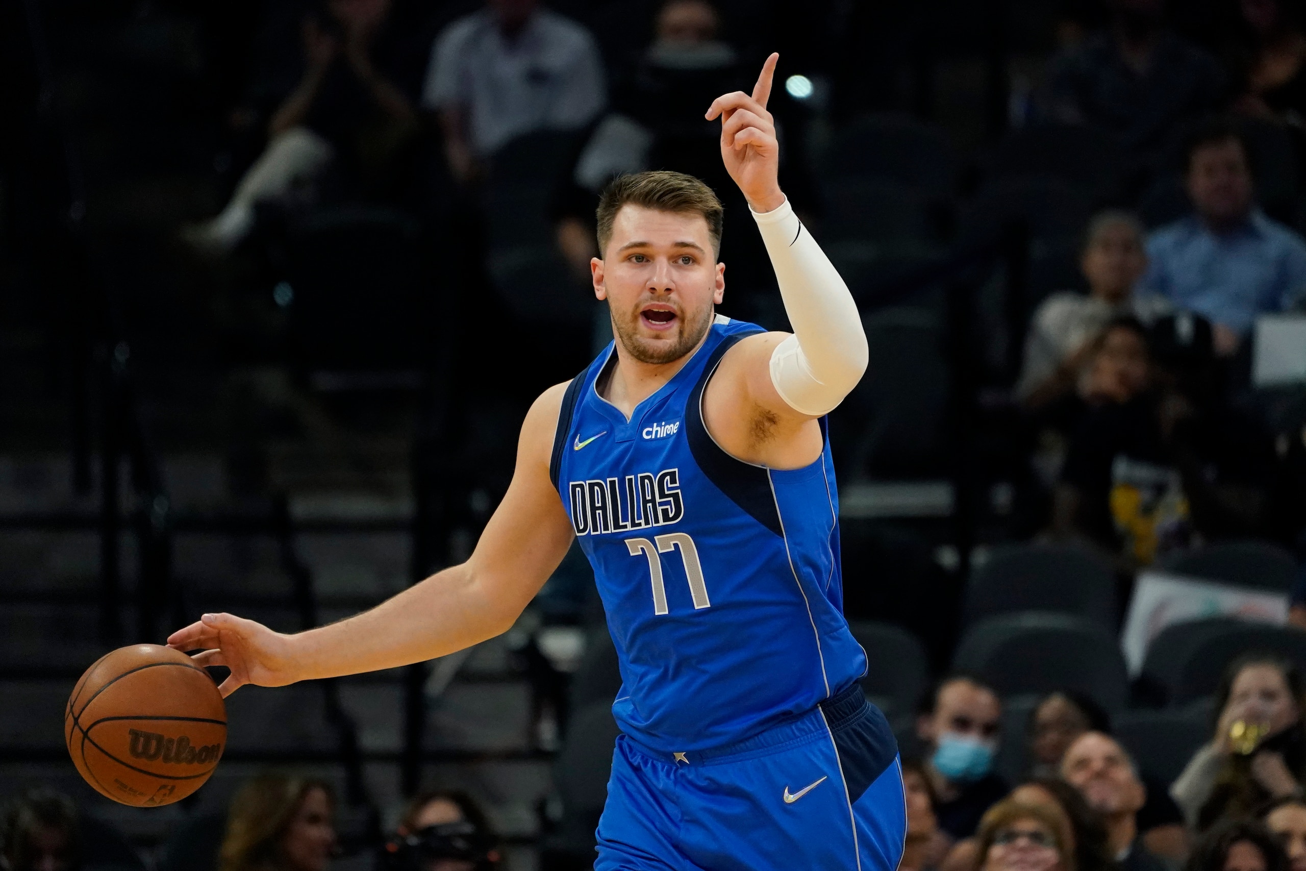 Dallas Mavericks guard Luka Doncic (77) moves the ball up court against the San Antonio Spurs during the first half of an NBA basketball game, Friday, Nov. 12, 2021, in San Antonio. (AP Photo/Eric Gay)