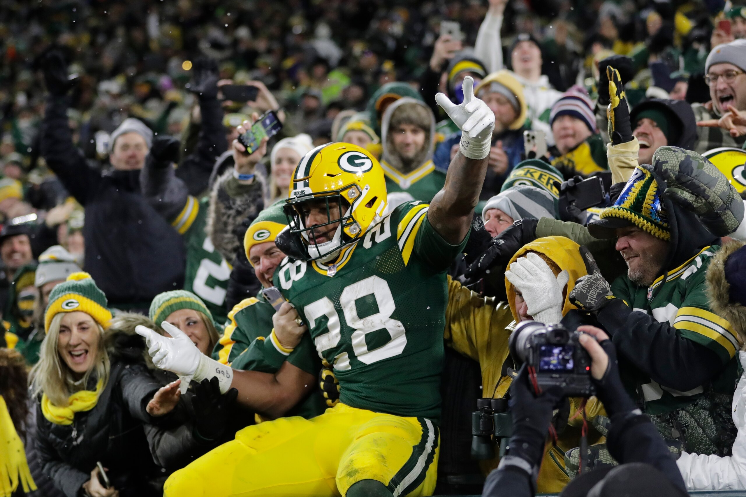 Green Bay Packers' AJ Dillon celebrates his second touchdown run during the second half of an NFL football game against the Seattle Seahawks Sunday, Nov. 14, 2021, in Green Bay, Wis. (AP Photo/Aaron Gash)