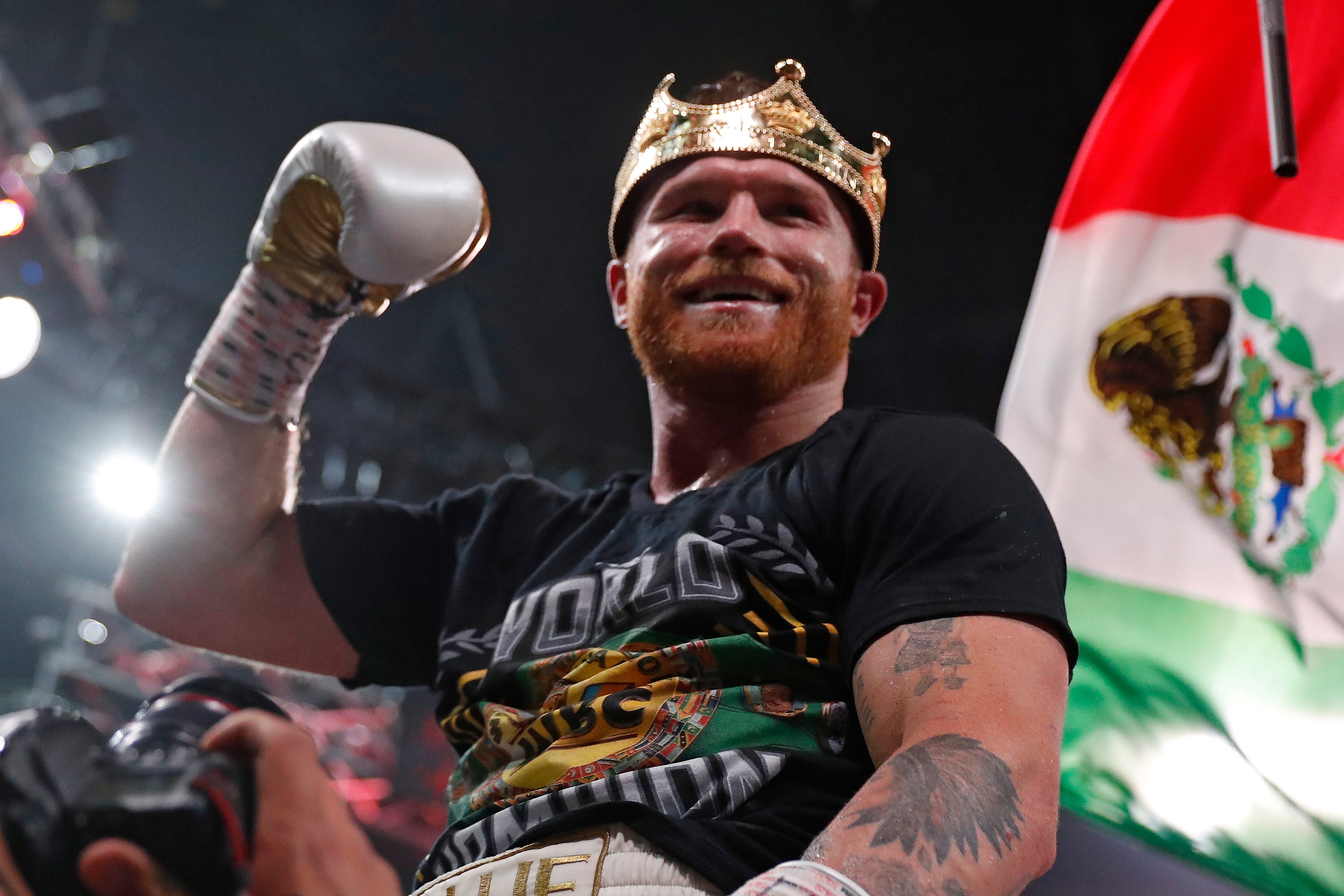 Canelo Alvarez, of Mexico, celebrates after defeating Caleb Plant by in a super middleweight title unification fight Saturday, Nov. 6, 2021, in Las Vegas. (AP Photo/Steve Marcus)