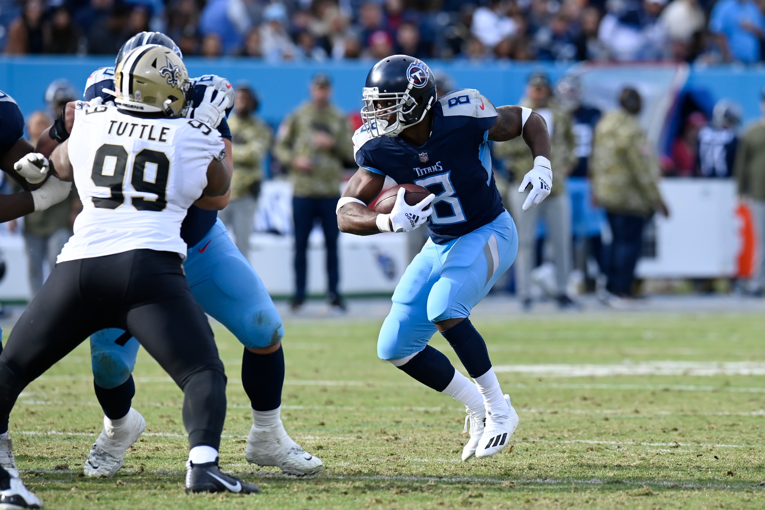 Tennessee Titans running back Adrian Peterson (8) carries the ball against the New Orleans Saints in the second half of an NFL football game Sunday, Nov. 14, 2021, in Nashville, Tenn. (AP Photo/Mark Zaleski)