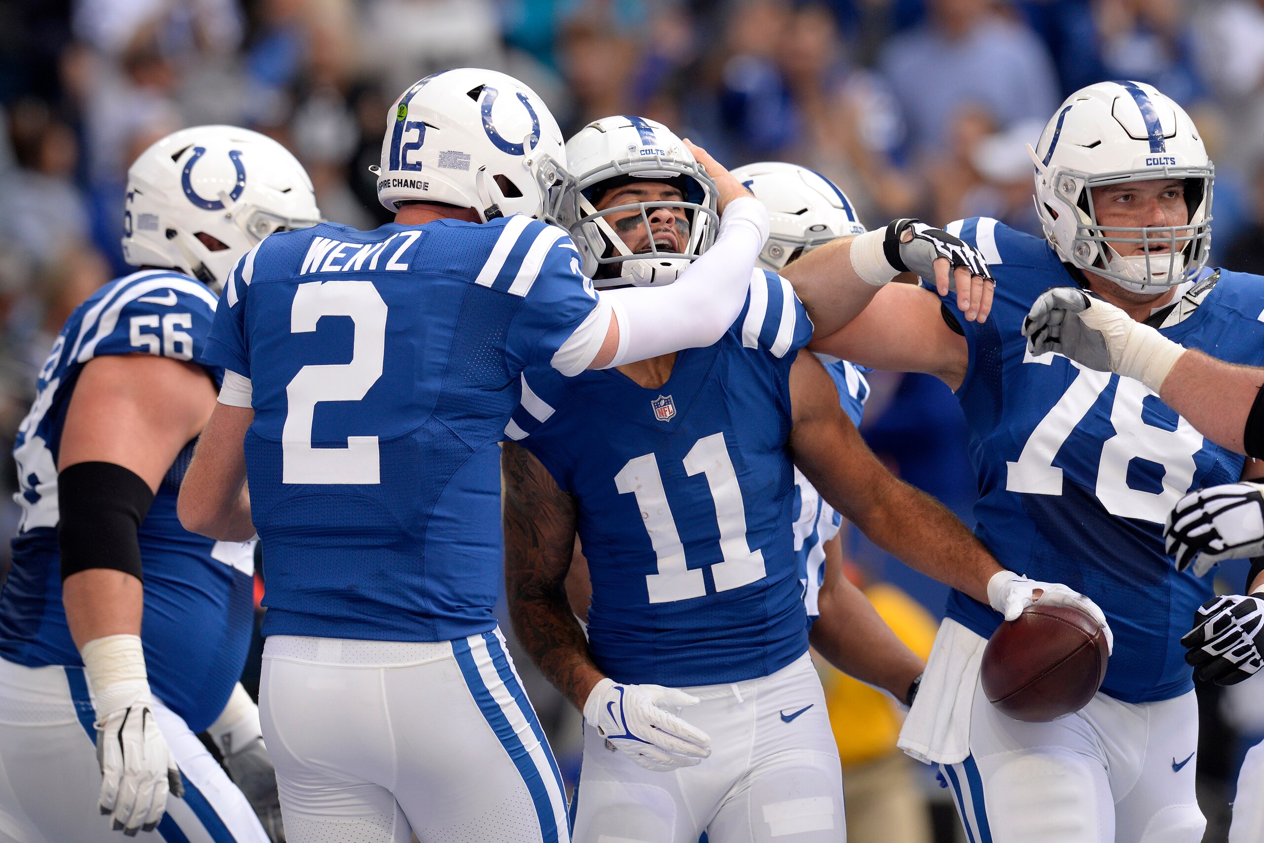 INDIANAPOLIS, IN - OCTOBER 31: Indianapolis Colts Quarterback Carson Wentz (2) embraces Indianapolis Colts Wide Receiver Michael Pittman (11) after a touchdown during the NFL football game between the Tennessee Titans and the Indianapolis Colts on October 31, 2021, at Lucas Oil Stadium in Indianapolis, Indiana. (Photo by Michael Allio/Icon Sportswire via Getty Images)