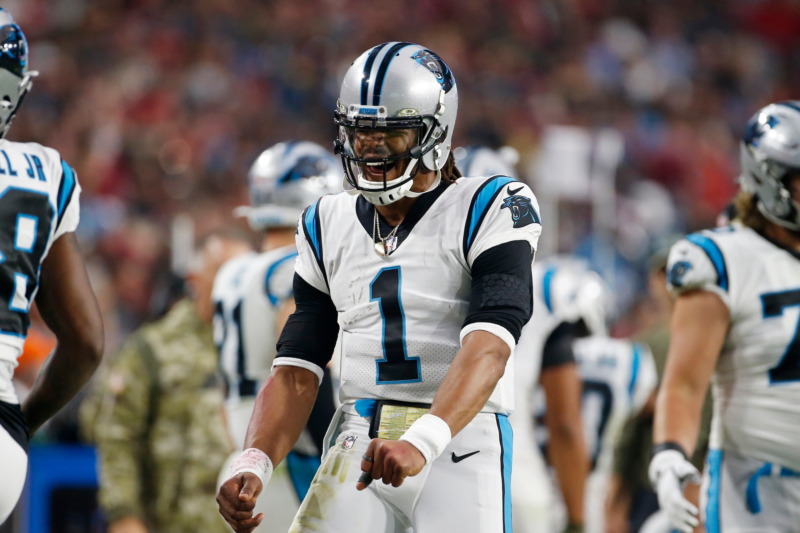 Carolina Panthers quarterback Cam Newton celebrates after a Panthers touchdown against the Arizona Cardinals during the second half of an NFL football game Sunday, Nov. 14, 2021, in Glendale, Ariz. (AP Photo/Ralph Freso)