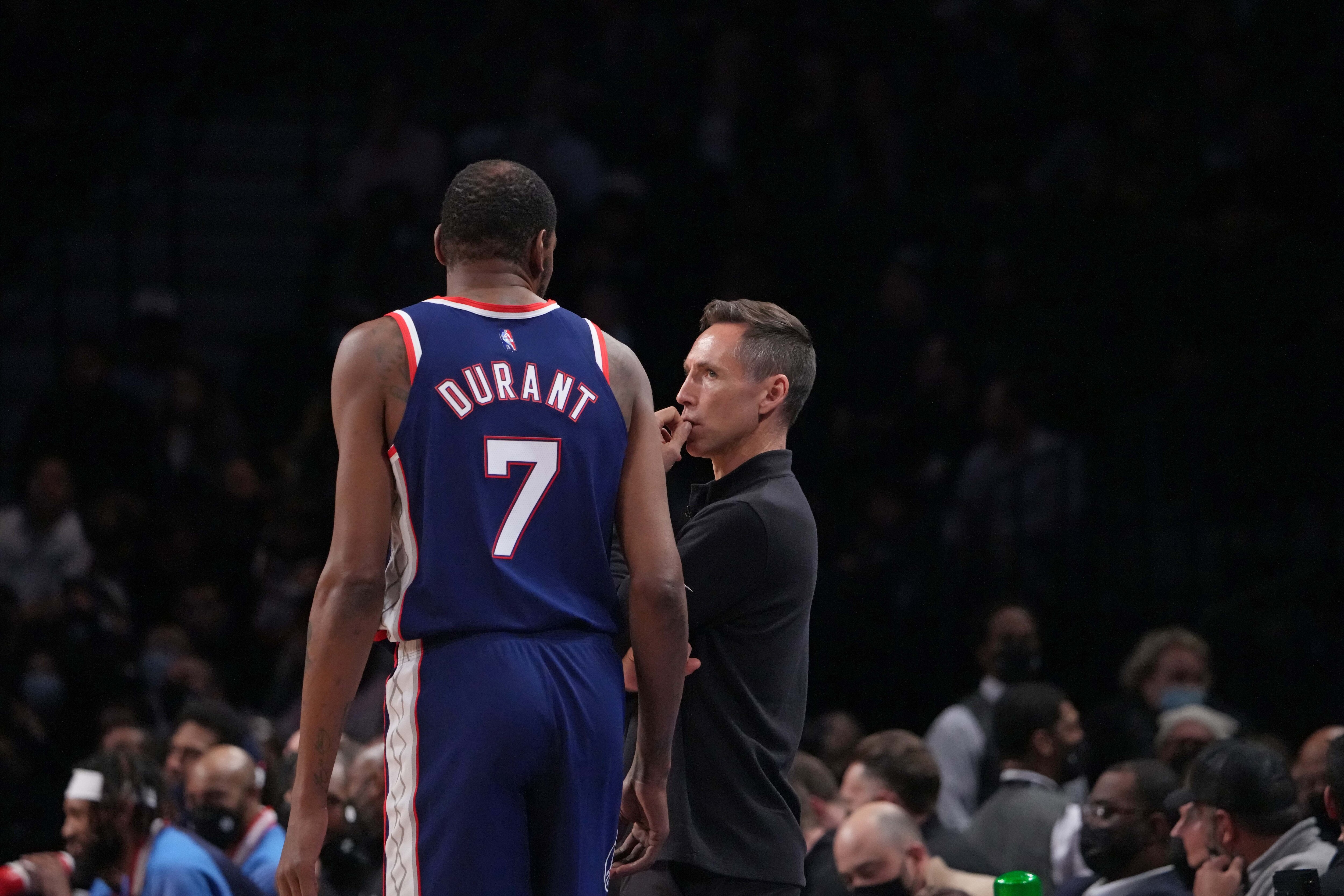 BROOKLYN, NY - NOVEMBER 16: Kevin Durant #7 of the Brooklyn Nets and Head Coach Steve Nash of the Brooklyn Nets talk during a game against the Golden State Warriors on November 16, 2021 at Barclays Center in Brooklyn, New York. NOTE TO USER: User expressly acknowledges and agrees that, by downloading and/or using this Photograph, user is consenting to the terms and conditions of the Getty Images License Agreement. Mandatory Copyright Notice: Copyright 2021 NBAE (Photo by Jesse D. Garrabrant/NBAE via Getty Images)