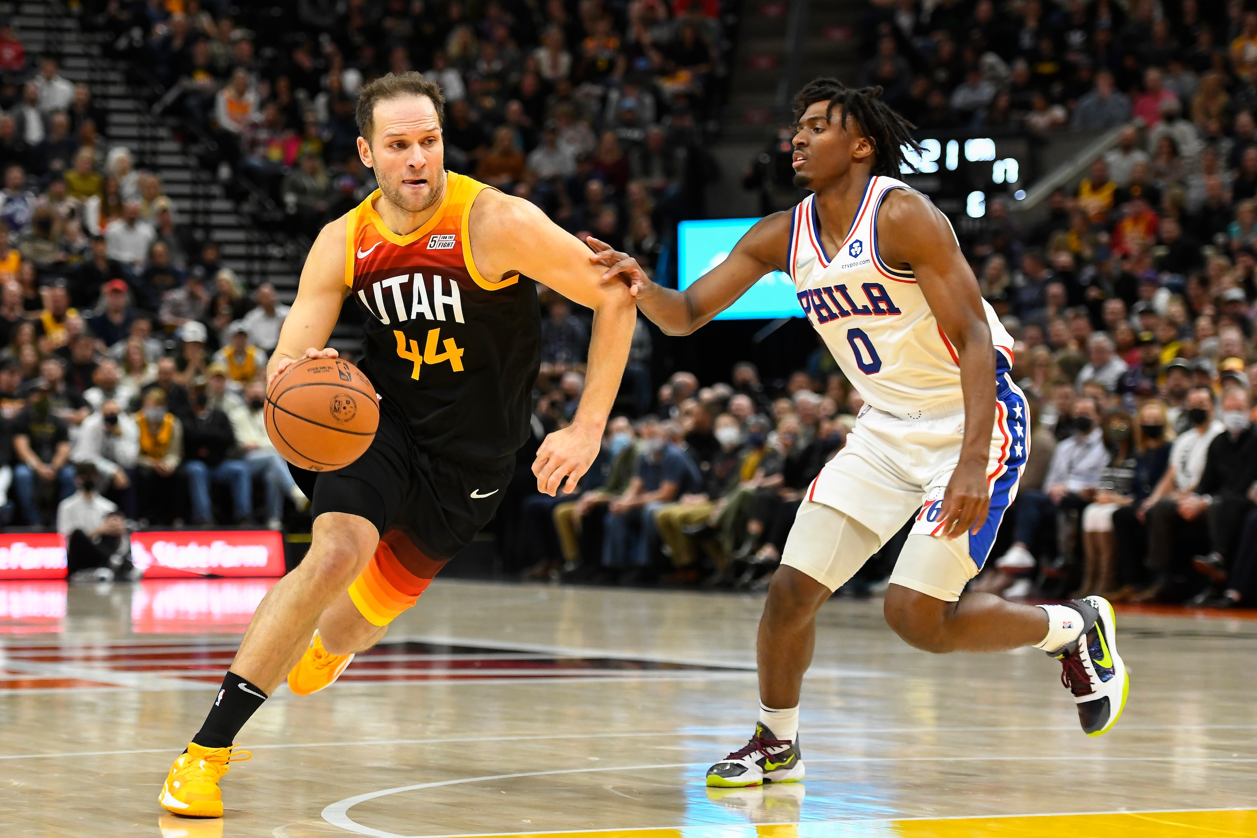 SALT LAKE CITY, UTAH - NOVEMBER 16: Bojan Bogdanovic #44 of the Utah Jazz dribbles past Tyrese Maxey #0 of the Philadelphia 76ers in the first half during a game at Vivint Smart Home Arena on November 16, 2021 in Salt Lake City, Utah. NOTE TO USER: User expressly acknowledges and agrees that, by downloading and or using this photograph, User is consenting to the terms and conditions of the Getty Images License Agreement.  (Photo by Alex Goodlett/Getty Images)
