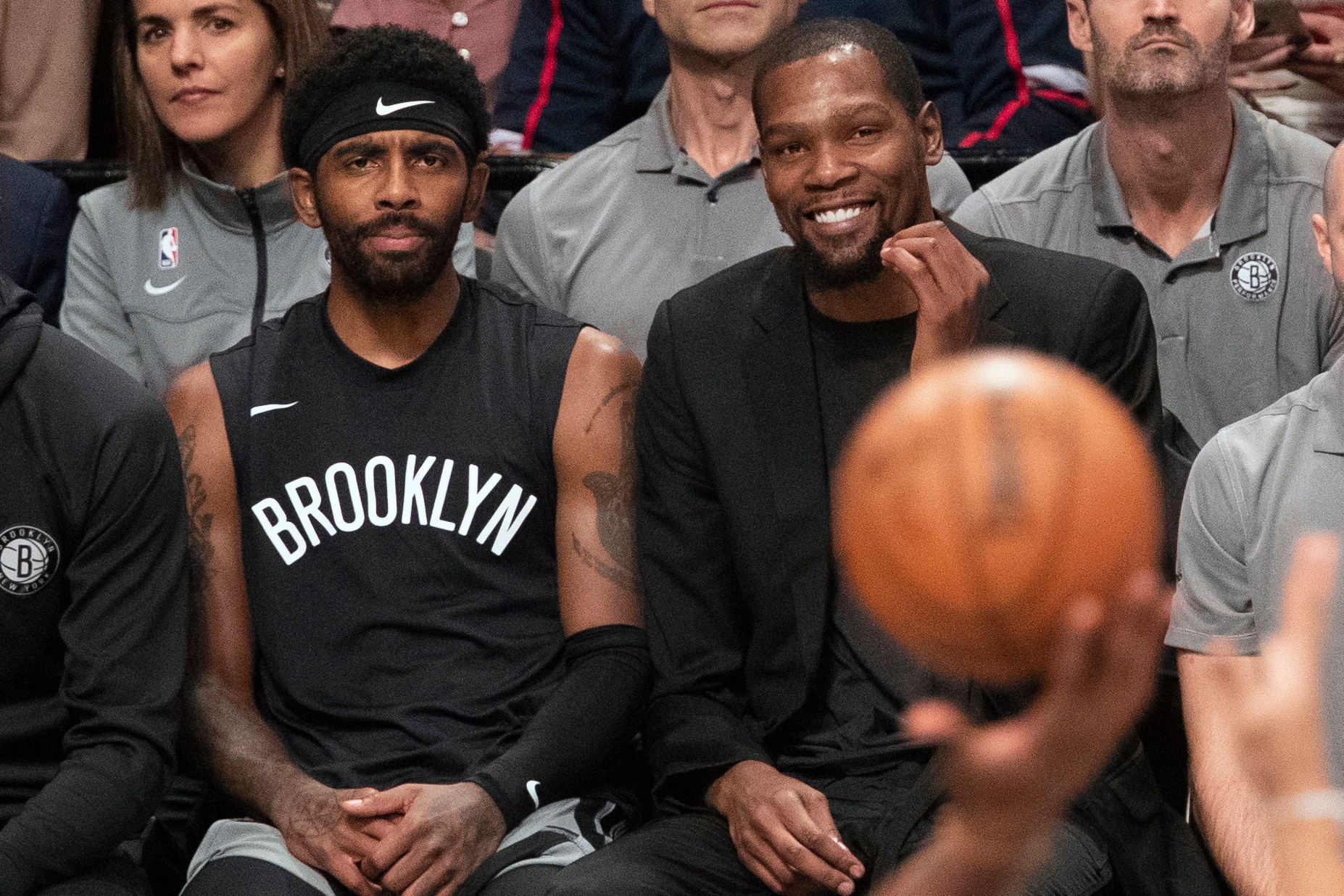 FILE - In this Nov. 1, 2019, file photo, Brooklyn Nets' Kyrie Irving, left, and Kevin Durant watch the game action from the bench during the second half of an NBA basketball game against the Houston Rockets in New York. With so much uncertainty around the NBA season, Brooklyn Nets general manager Sean Marks is no longer ruling Kevin Durant out for the season. Marks had repeatedly said he didn't expect Durant to play this season while recovering from Achilles tendon surgery, but he acknowledged Wednesday that everything is unknown now that the season is suspended because of the new coronavirus. Even Kyrie Irving, who had shoulder surgery on March 3, might be available if play stretched into the summer. (AP Photo/Mary Altaffer, File)