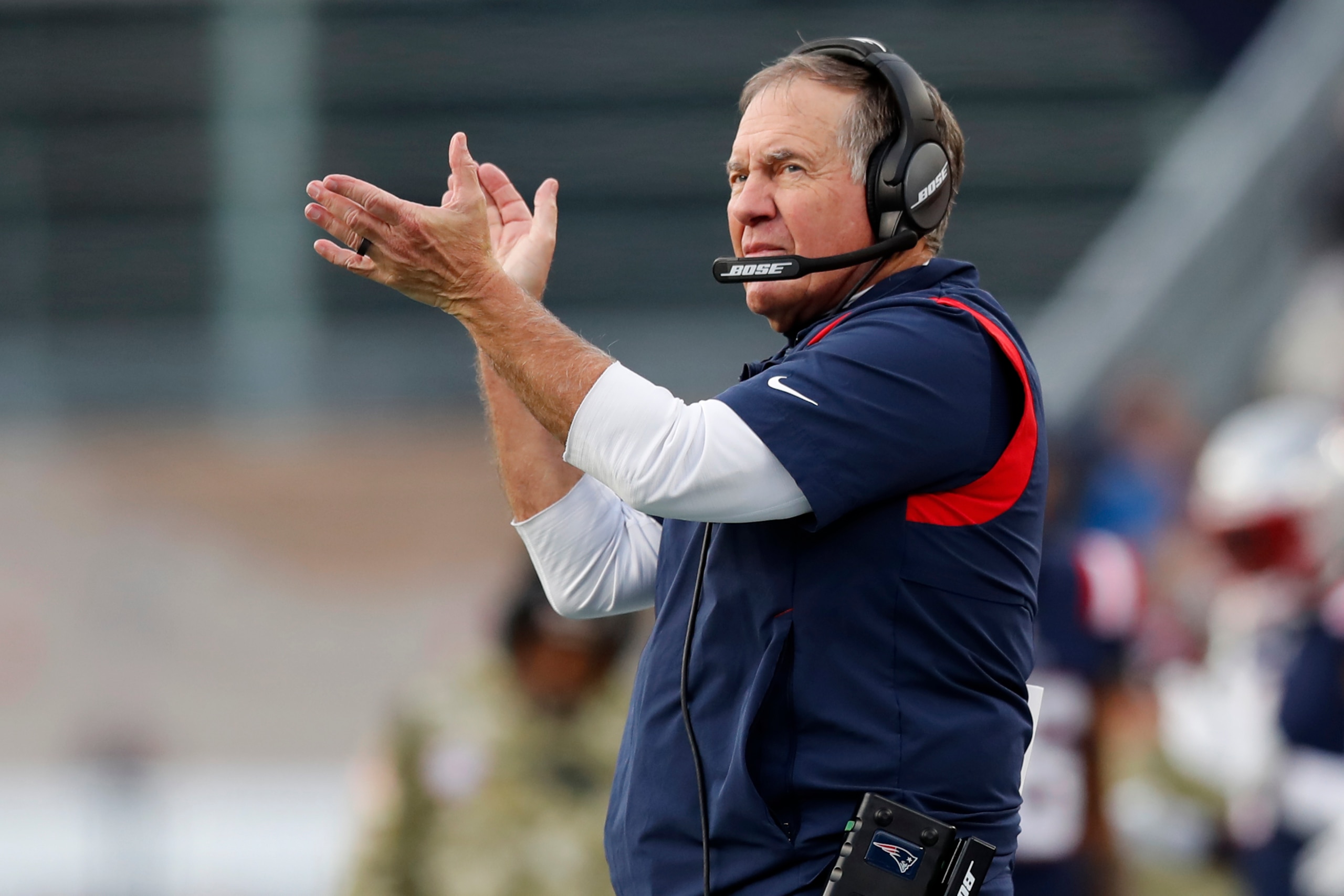 New England Patriots head coach Bill Belichick applauds towards his players on the field during the second half of an NFL football game against the Cleveland Browns, Sunday, Nov. 14, 2021, in Foxborough, Mass. (AP Photo/Michael Dwyer)