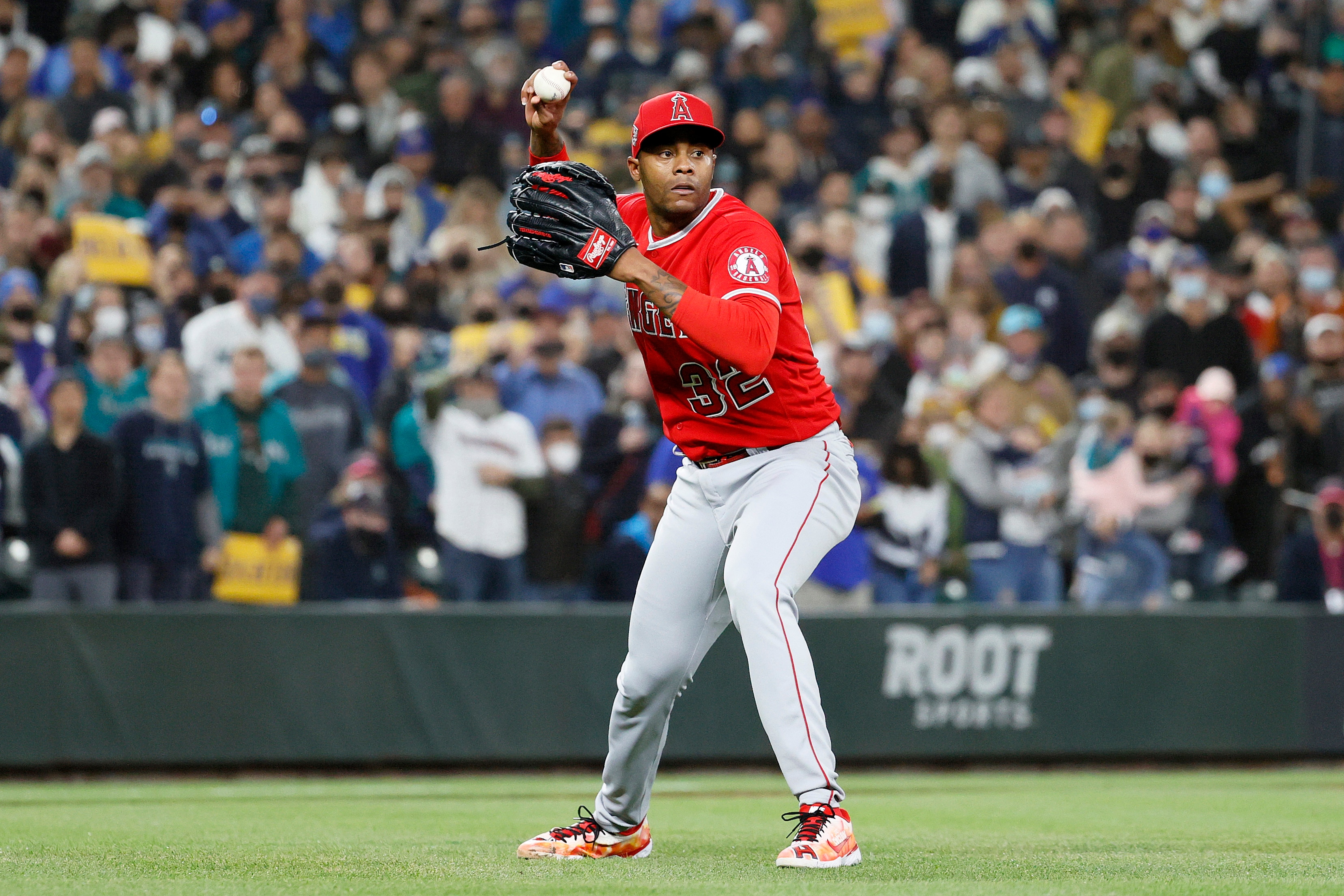 SEATTLE, WASHINGTON - OCTOBER 01: Raisel Iglesias #32 of the Los Angeles Angels makes a play during the ninth inning against the Seattle Mariners at T-Mobile Park on October 01, 2021 in Seattle, Washington. (Photo by Steph Chambers/Getty Images)