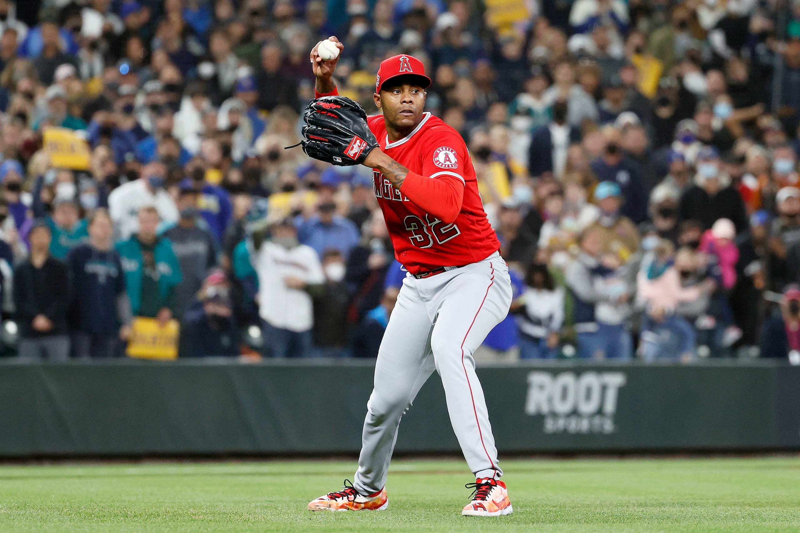 SEATTLE, WASHINGTON - OCTOBER 01: Raisel Iglesias #32 of the Los Angeles Angels makes a play during the ninth inning against the Seattle Mariners at T-Mobile Park on October 01, 2021 in Seattle, Washington. (Photo by Steph Chambers/Getty Images)