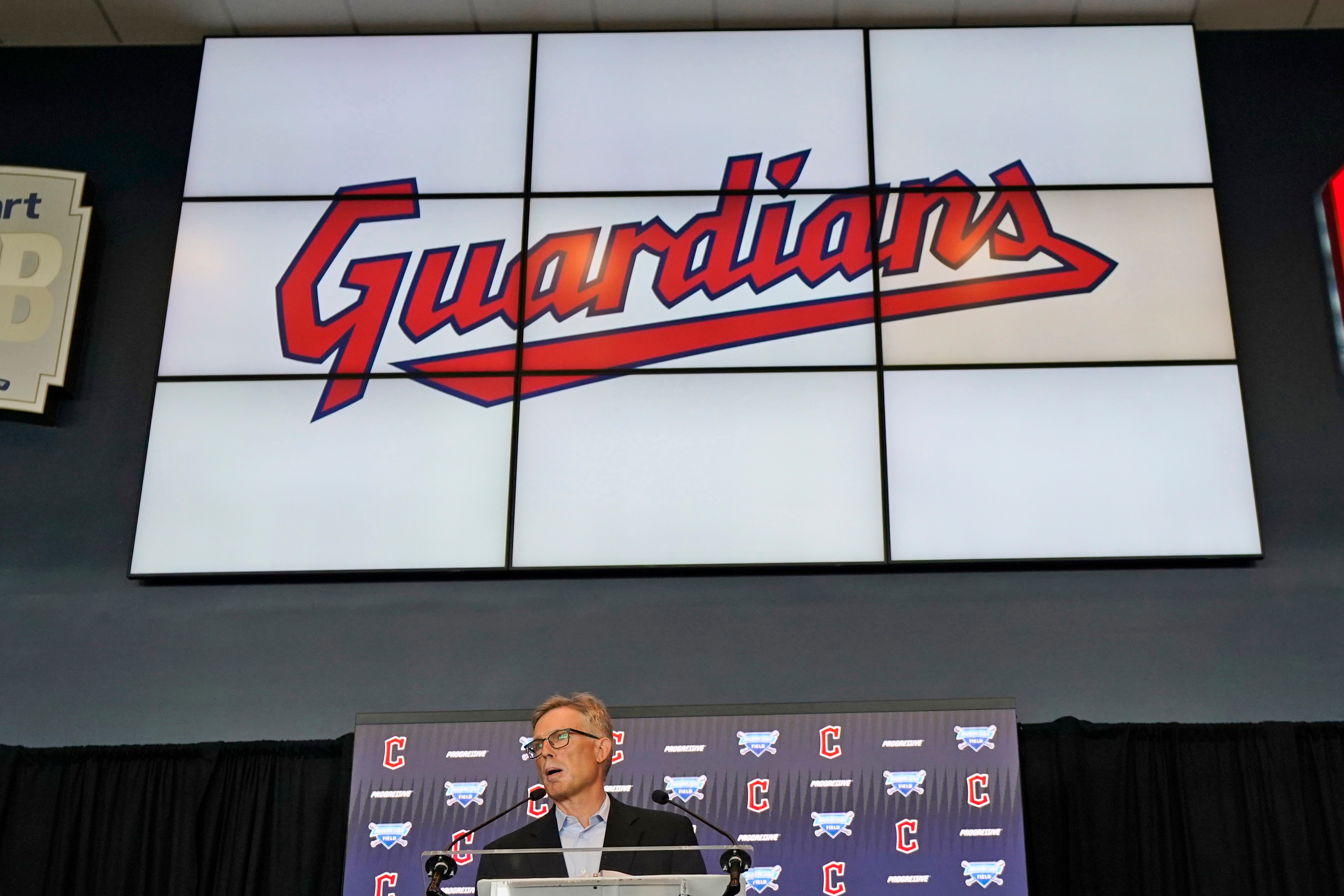 FILE - Cleveland Indians owner Paul Dolan speaks to the media during a news conference, Friday, July 23, 2021, in Cleveland. The Cleveland Indians have resolved a lawsuit filed by a local roller derby team over rights to the name Guardians, the final hurdle for the Major League Baseball team to continue its changeover. The sides jointly announced an “amicable resolution” on Tuesday, Nov. 16, 2021, saying both organizations will continue to use Guardians. (AP Photo/Tony Dejak, File)