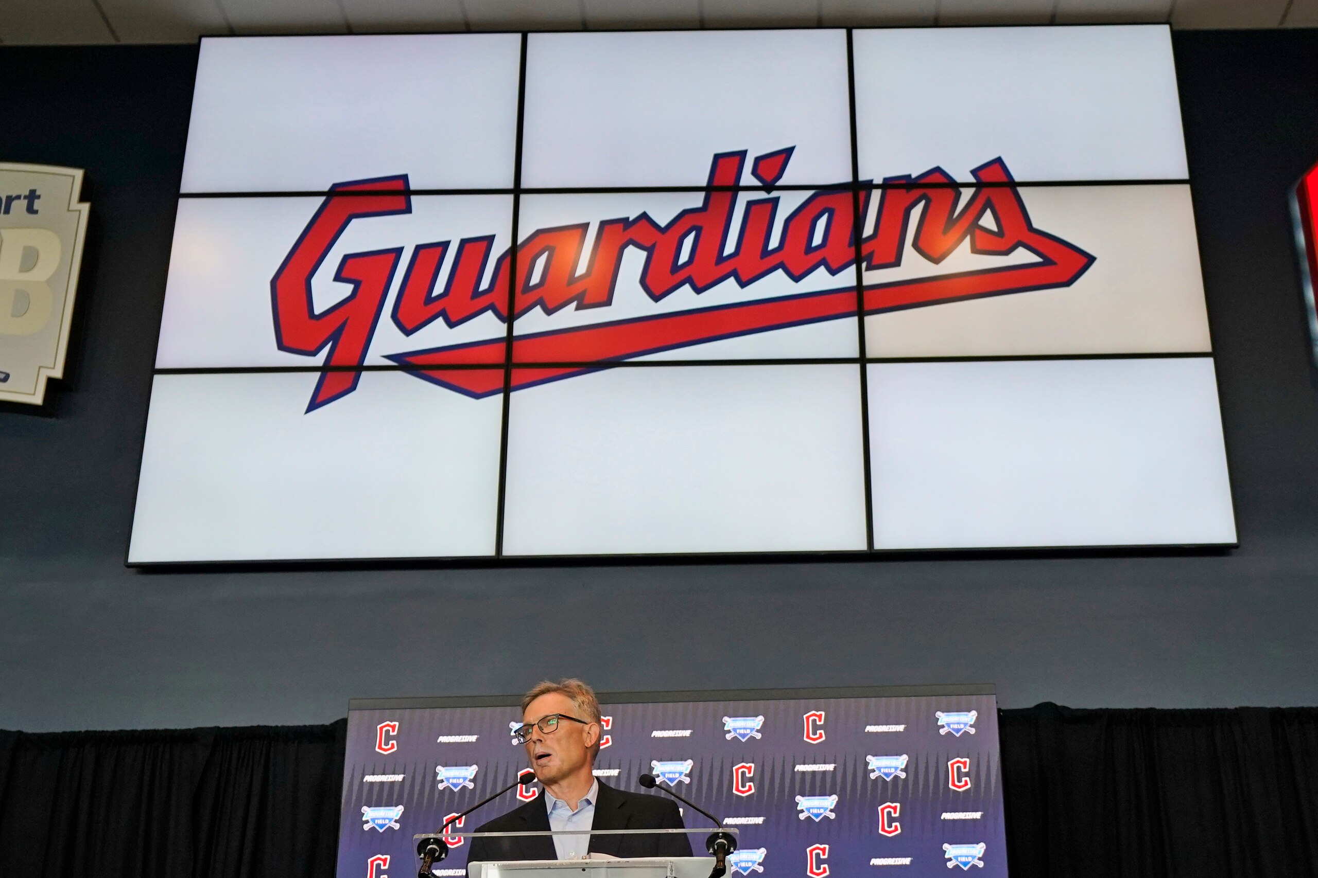 FILE - Cleveland Indians owner Paul Dolan speaks to the media during a news conference, Friday, July 23, 2021, in Cleveland. The Cleveland Indians have resolved a lawsuit filed by a local roller derby team over rights to the name Guardians, the final hurdle for the Major League Baseball team to continue its changeover. The sides jointly announced an “amicable resolution” on Tuesday, Nov. 16, 2021, saying both organizations will continue to use Guardians. (AP Photo/Tony Dejak, File)