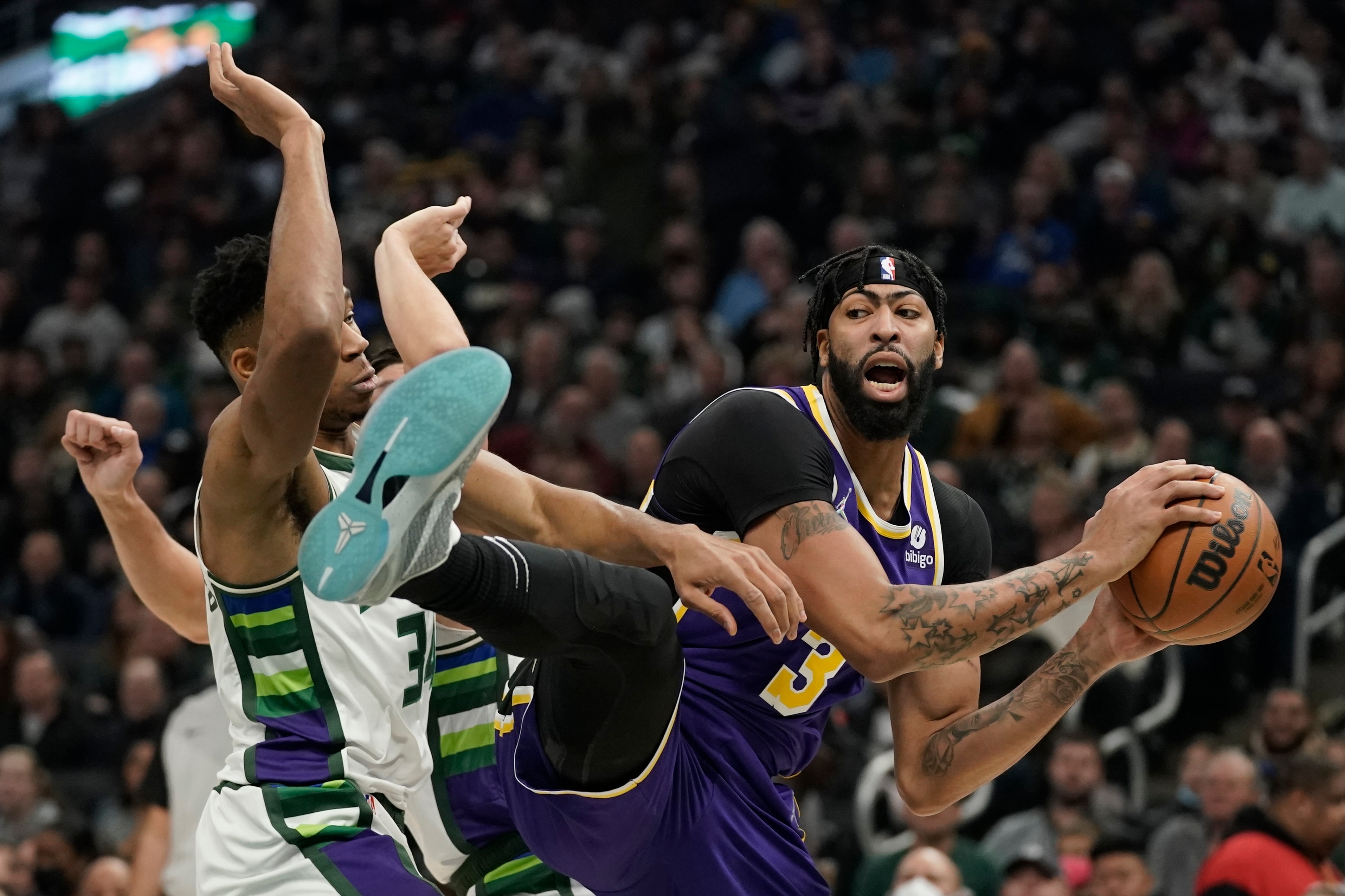 Los Angeles Lakers' Anthony Davis grabs a rebound in front of Milwaukee Bucks' Giannis Antetokounmpo during the first half of an NBA basketball game Wednesday, Nov. 17, 2021, in Milwaukee. (AP Photo/Morry Gash) Los Angeles Lakers' Anthony Davis grabs a rebound in front of Milwaukee Bucks' Giannis Antetokounmpo during the first half of an NBA basketball game Wednesday, Nov. 17, 2021, in Milwaukee. (AP Photo/Morry Gash)
