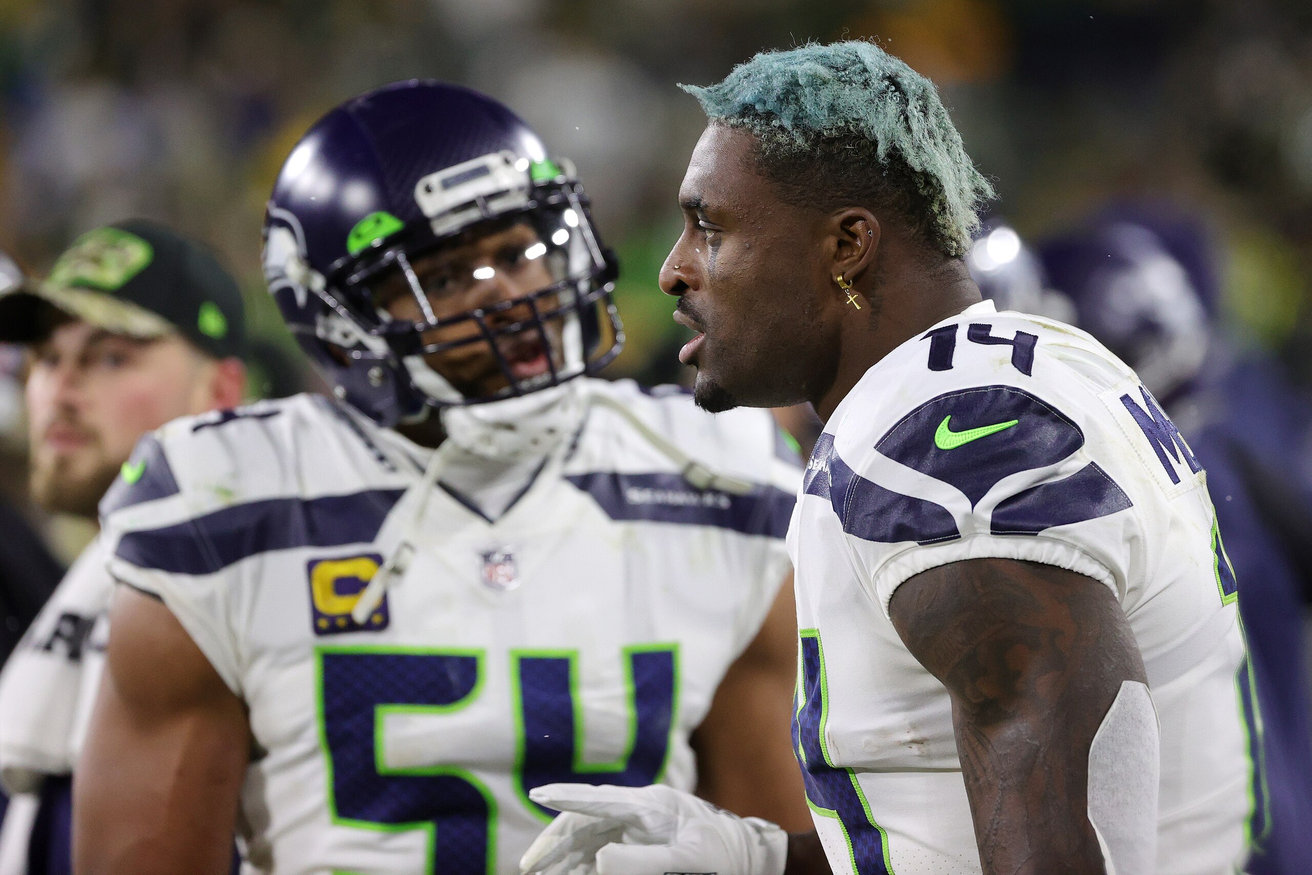 GREEN BAY, WISCONSIN - NOVEMBER 14: DK Metcalf #14 of the Seattle Seahawks reacts alongside Bobby Wagner #54 against the Green Bay Packers during the fourth quarter at Lambeau Field on November 14, 2021 in Green Bay, Wisconsin. (Photo by Stacy Revere/Getty Images)