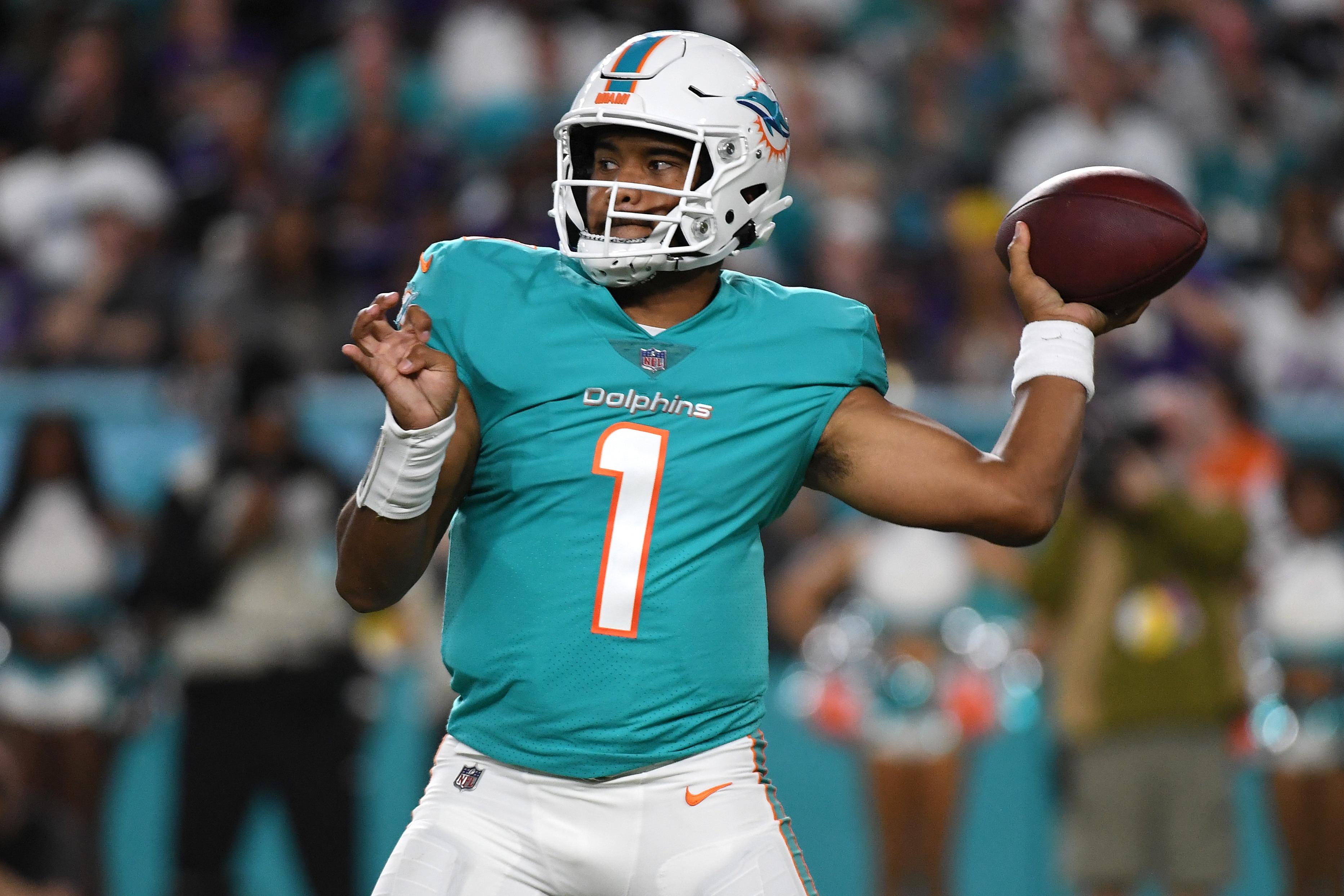 MIAMI GARDENS, FLORIDA - NOVEMBER 11: Tua Tagovailoa #1 of the Miami Dolphins throws a pass against the Baltimore Ravens during the third quarter in the game at Hard Rock Stadium on November 11, 2021 in Miami Gardens, Florida. (Photo by Eric Espada/Getty Images)