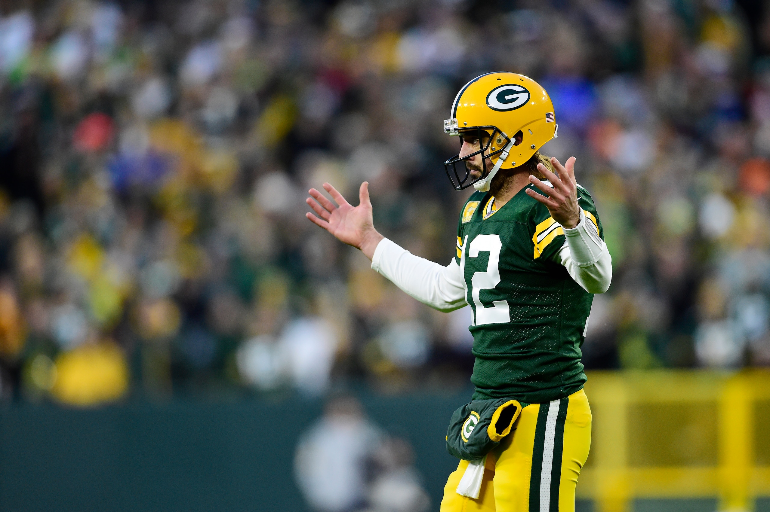 GREEN BAY, WISCONSIN - NOVEMBER 14: Aaron Rodgers #12 of the Green Bay Packers reacts after throwing an incomplete pass on third down during the first half against the Seattle Seahawks at Lambeau Field on November 14, 2021 in Green Bay, Wisconsin. (Photo by Patrick McDermott/Getty Images)