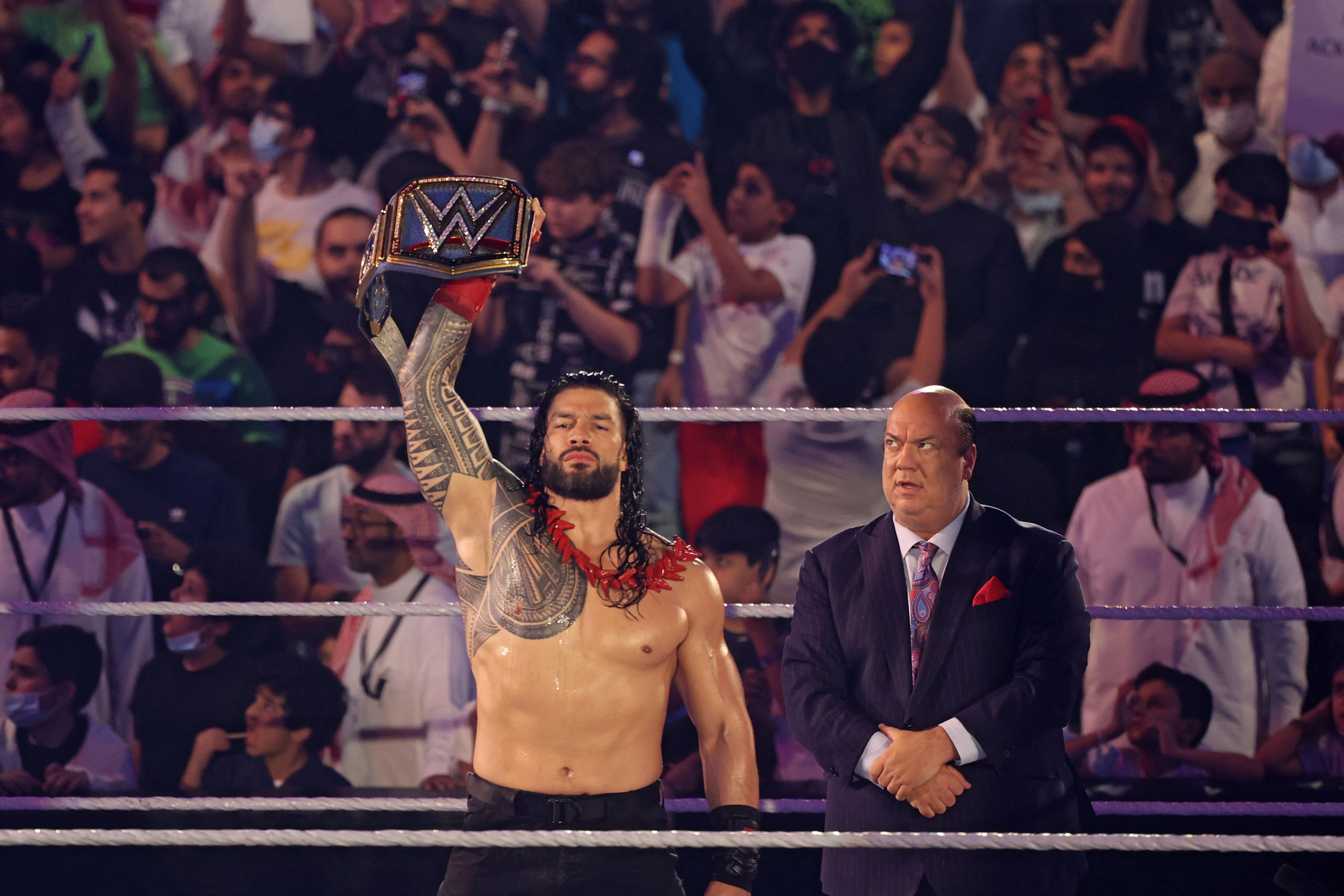 Roman Reigns greets the fans ahead of his match during the World Wrestling Entertainment (WWE) Crown Jewel pay-per-view in the Saudi capital Riyadh on October 21, 2021. (Photo by Fayez Nureldine / AFP) (Photo by FAYEZ NURELDINE/AFP via Getty Images)