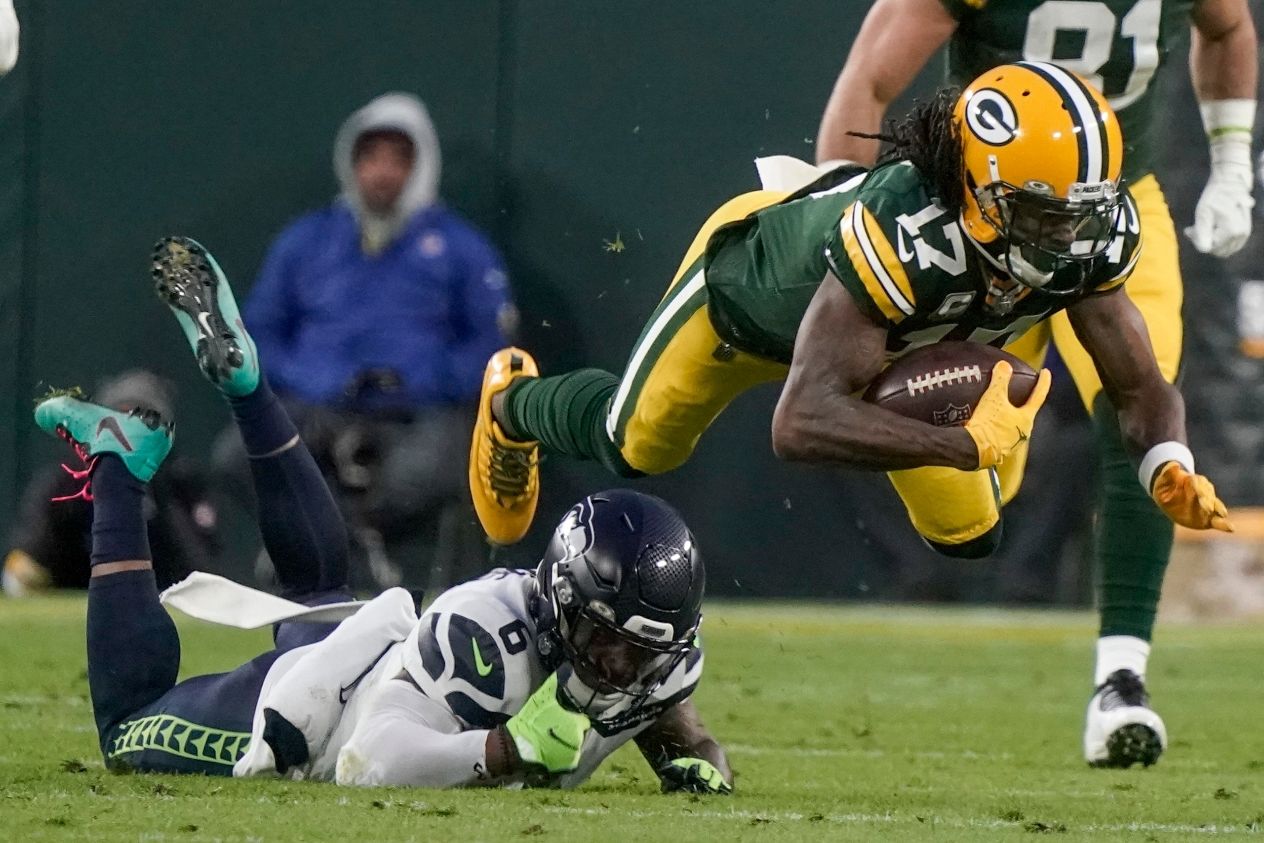 Seattle Seahawks' Quandre Diggs stops Green Bay Packers' Davante Adams after a catch during the first half of an NFL football game Sunday, Nov. 14, 2021, in Green Bay, Wis. (AP Photo/Morry Gash)
