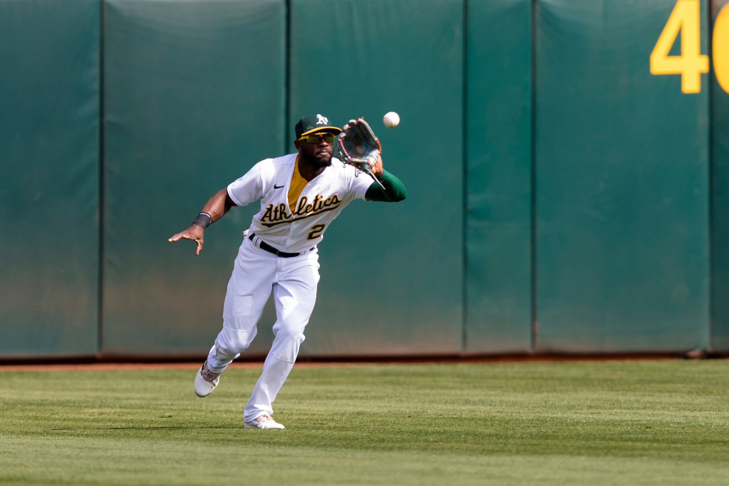 Oakland Athletics center fielder Starling Marte catches a fly ball by the Houston Astros in the second inning of a baseball game in Oakland, Calif., Sunday, Sept. 26, 2021. (AP Photo/John Hefti)