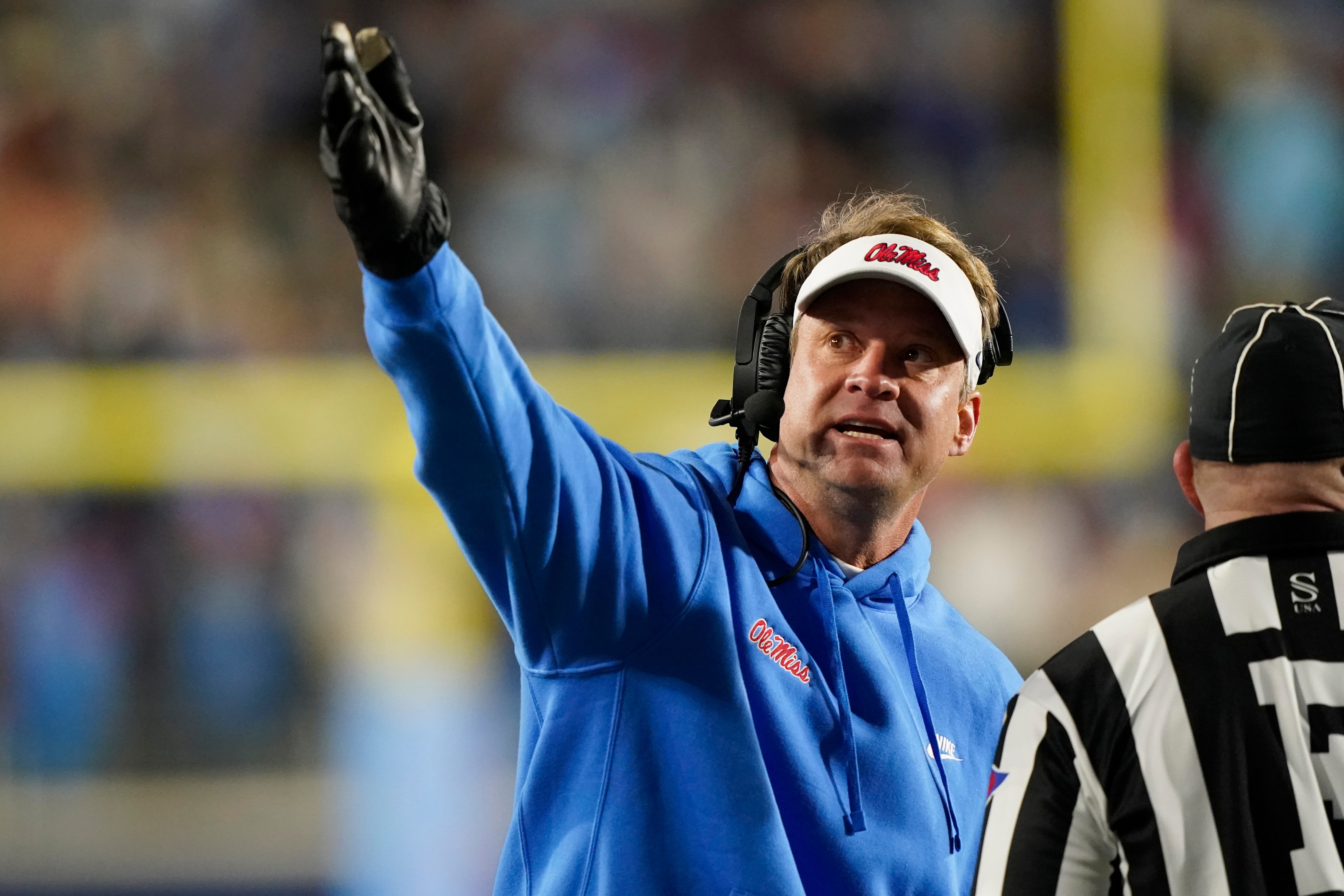 Mississippi head coach Lane Kiffin argues a call, that is shown on the stadium monitor, with a field official during the second half of an NCAA college football game against Texas A&M, Saturday, Nov. 13, 2021, in Oxford, Miss. Mississippi won 29-19. (AP Photo/Rogelio V. Solis)