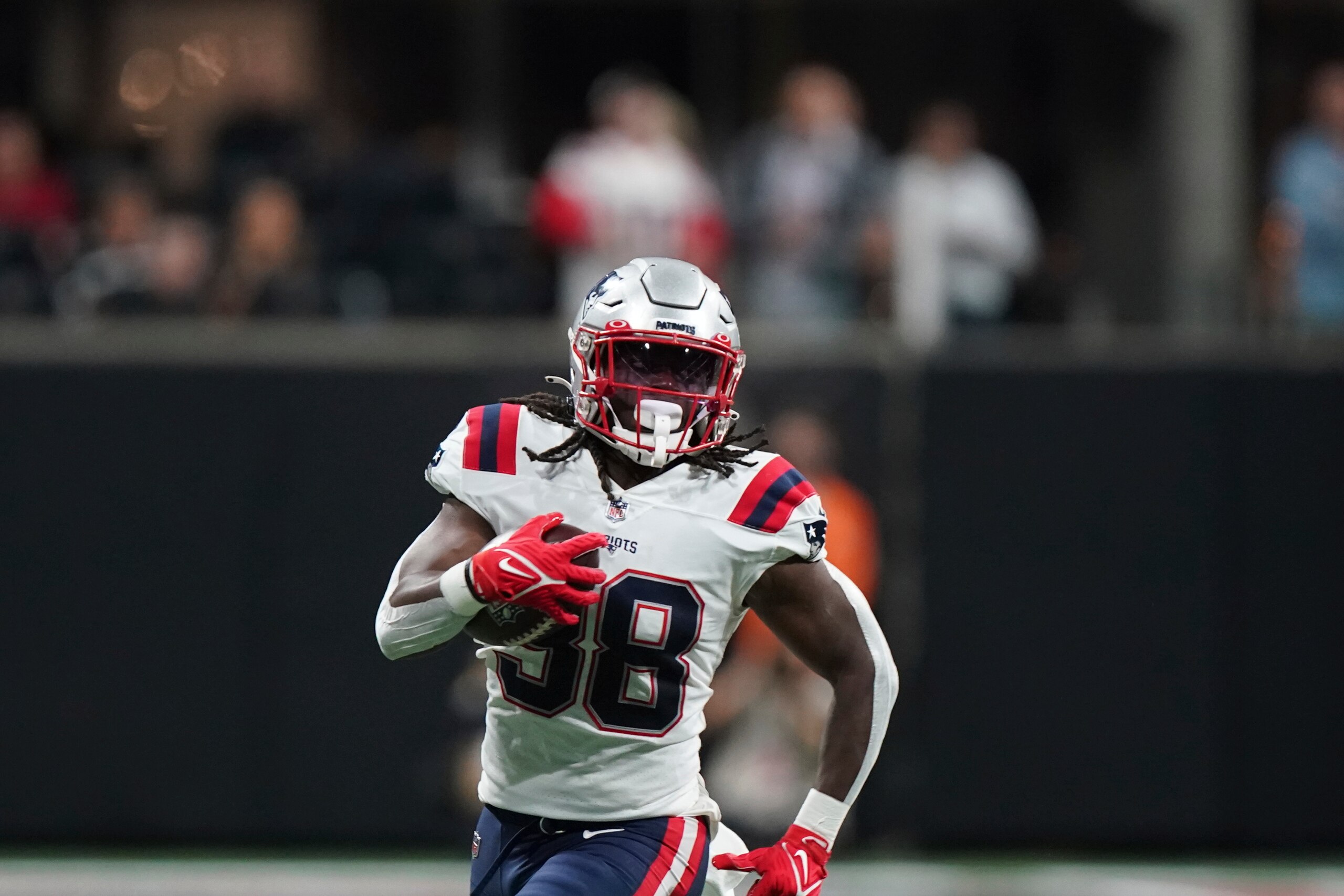 New England Patriots running back Rhamondre Stevenson (38) runs against the Atlanta Falcons during the first half of an NFL football game, Thursday, Nov. 18, 2021, in Atlanta. (AP Photo/Brynn Anderson)