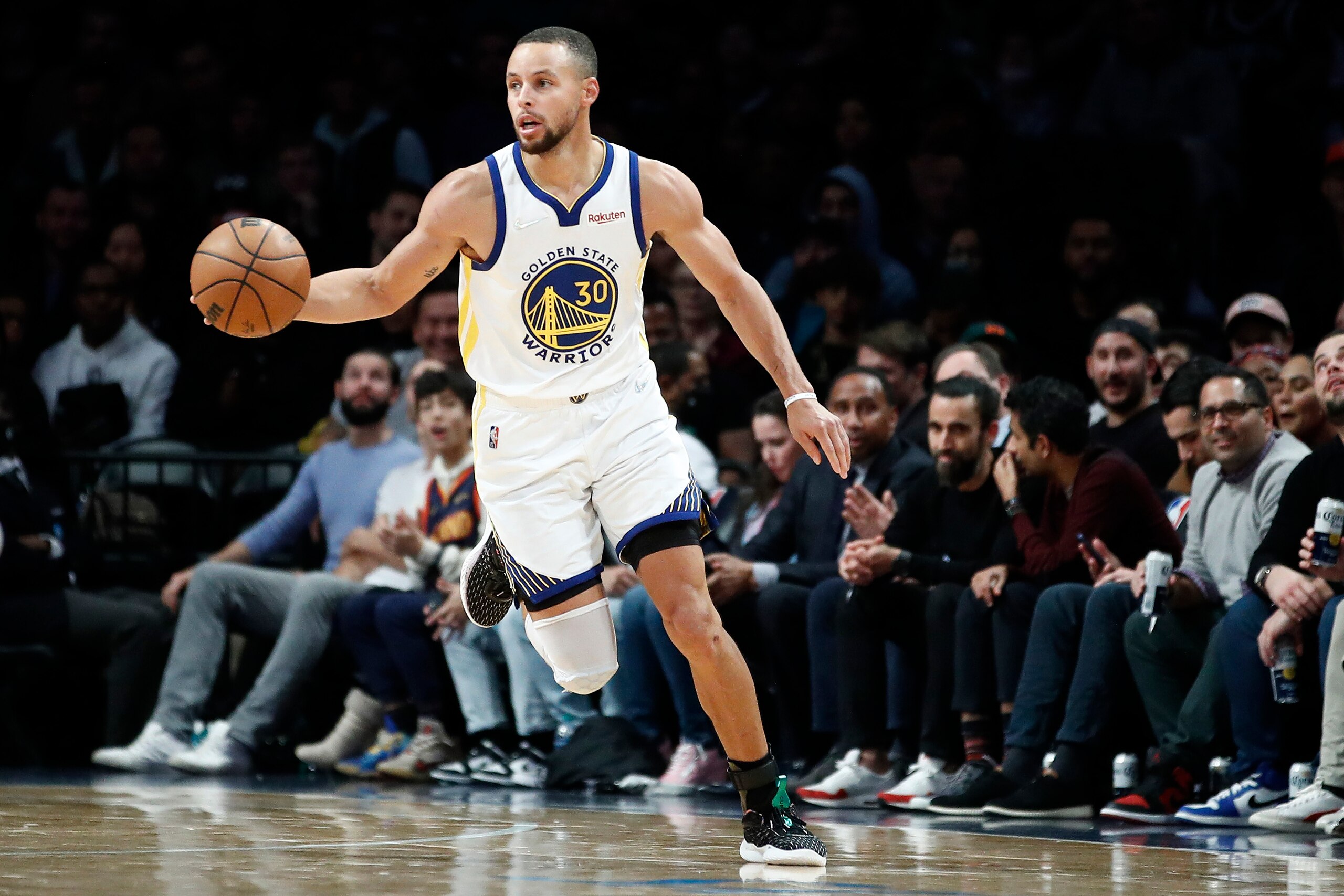NEW YORK, NEW YORK - NOVEMBER 16: Stephen Curry #30 of the Golden State Warriors dribbles during the second half against the Brooklyn Nets at Barclays Center on November 16, 2021 in the Brooklyn borough of New York City. The Warriors won 117-99. NOTE TO USER: User expressly acknowledges and agrees that, by downloading and or using this photograph, User is consenting to the terms and conditions of the Getty Images License Agreement. (Photo by Sarah Stier/Getty Images)