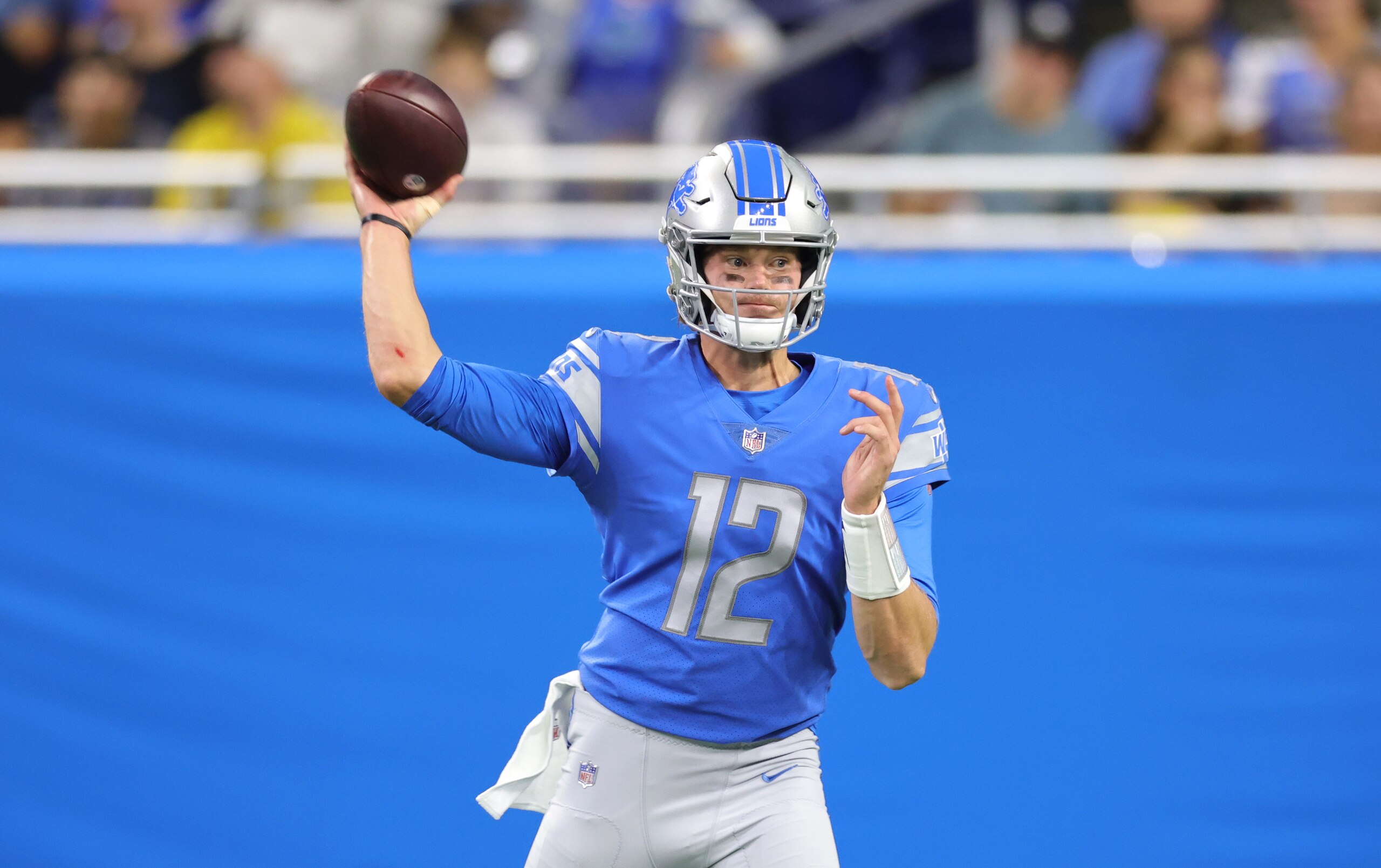 DETROIT, MICHIGAN - AUGUST 27: Tim Boyle #12 of the Detroit Lions drops back to pass during the second quarter of the game against the Indianapolis Colts at Ford Field on August 27, 2021 in Detroit, Michigan. (Photo by Leon Halip/Getty Images)
