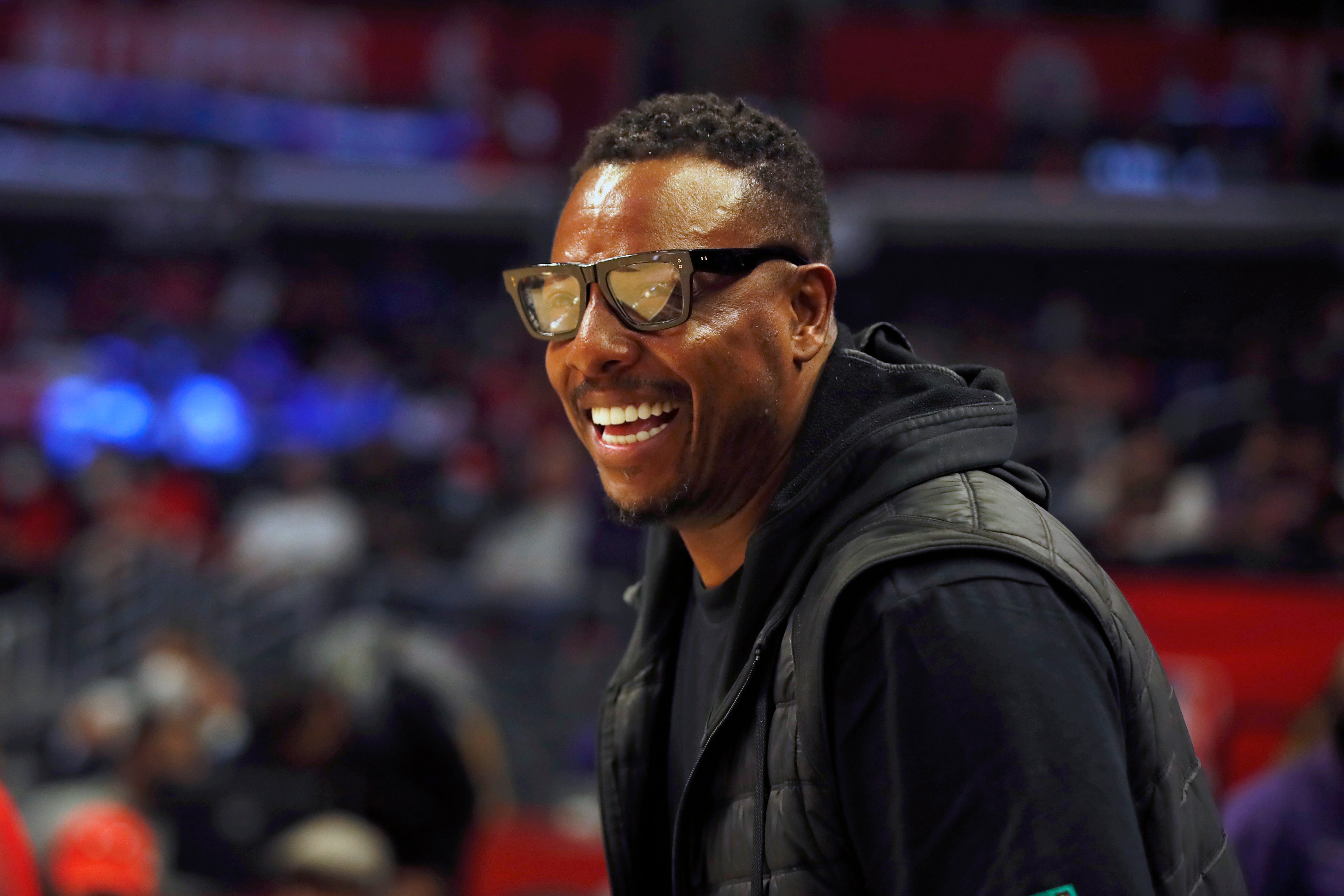 Former NBA basketball player Paul Pierce smiles watching warmups before an NBA basketball game between the Los Angeles Clippers and the Chicago Bulls Sunday, Nov. 14, 2021, in Los Angeles. (AP Photo/Alex Gallardo)