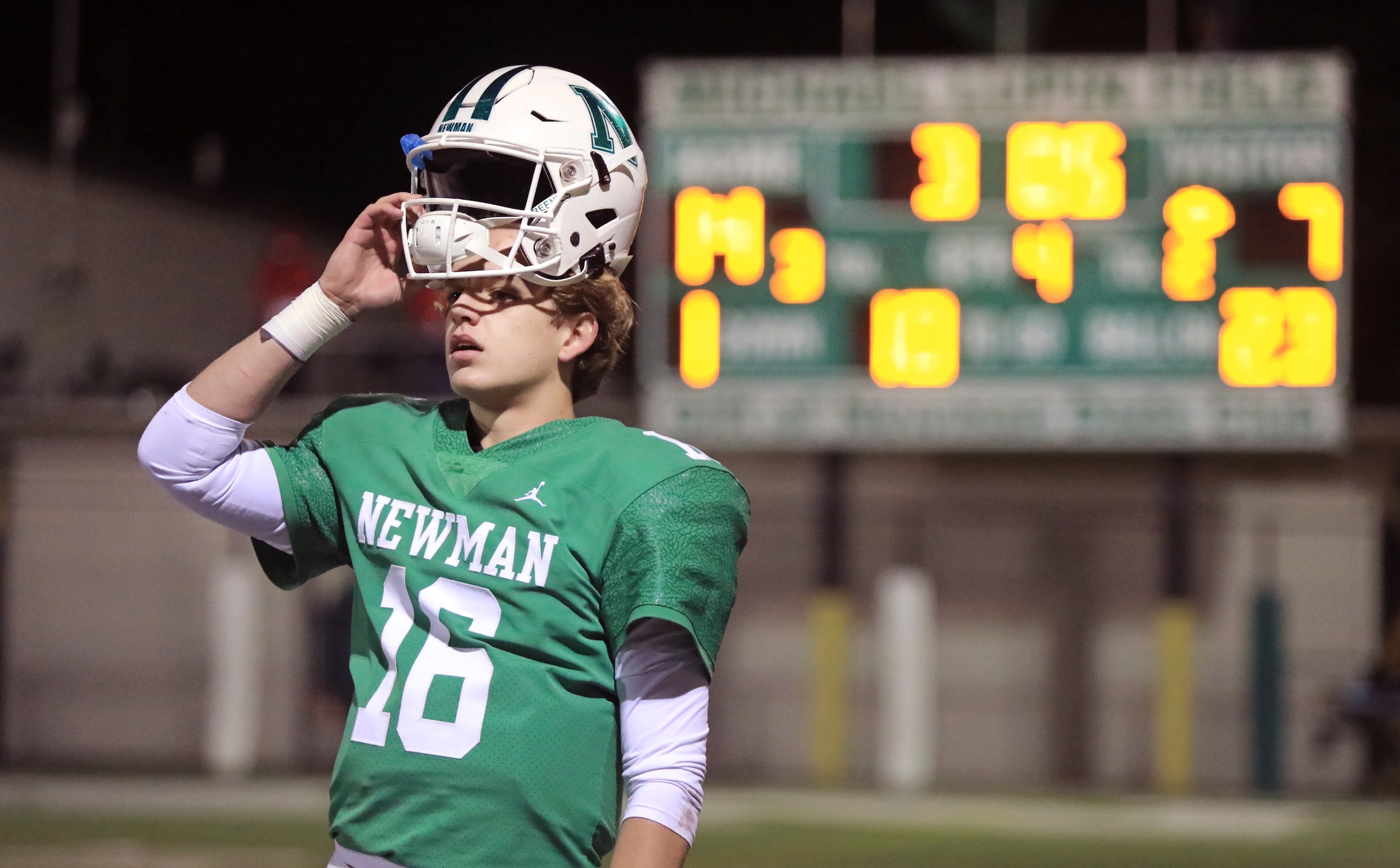 Newman High School quarterback Arch Manning (16) watches the extra point from the sideline after the winning touchdown, during a playoff game against Catholic High of New Iberia, in New Orleans, Friday, Dec. 4, 2020. (AP Photo/Ted Jackson)