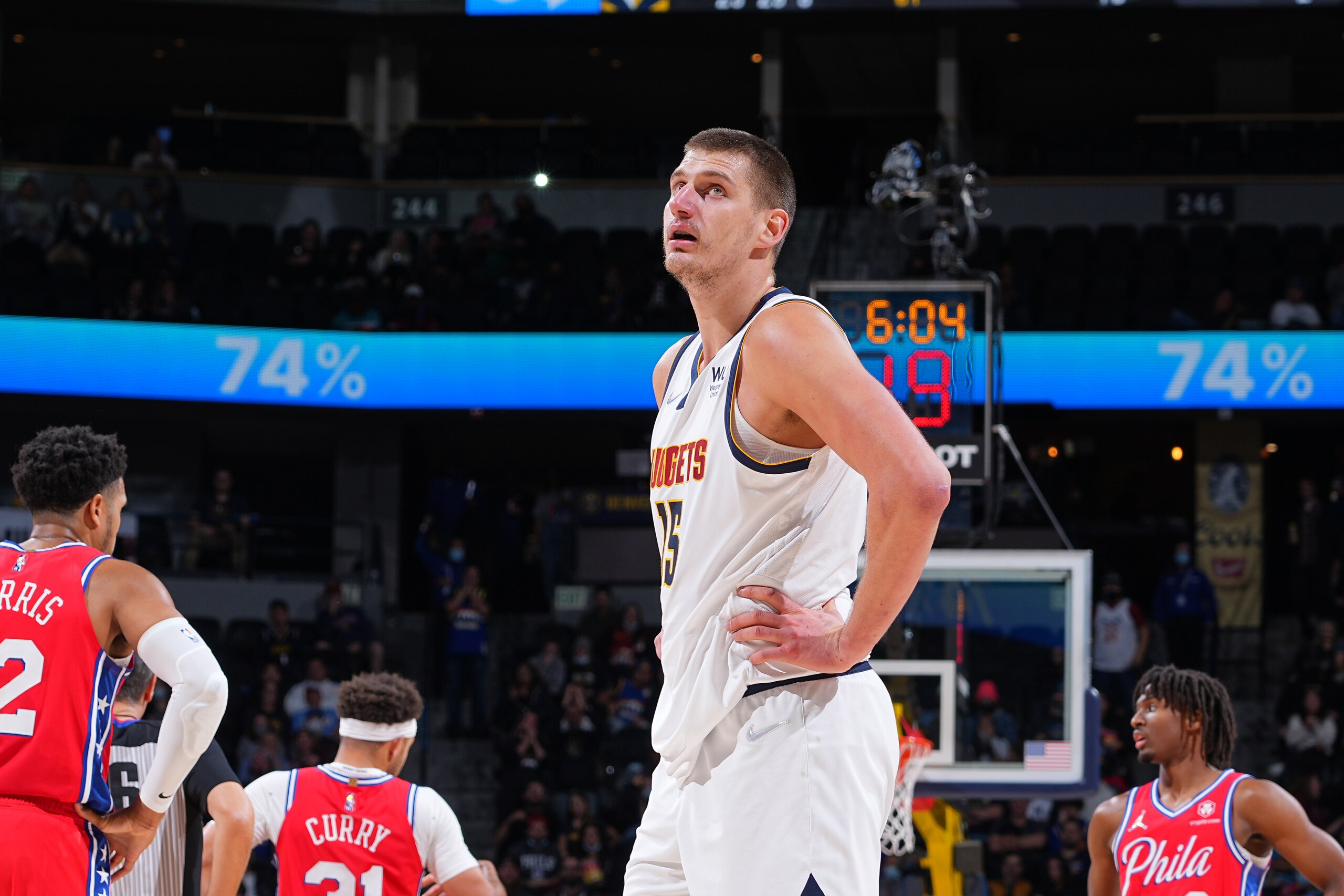 DENVER, CO - NOVEMBER 18: Nikola Jokic #15 of the Denver Nuggets looks on during a game against the Philadelphia 76ers on November 18, 2021 at the Ball Arena in Denver, Colorado. NOTE TO USER: User expressly acknowledges and agrees that, by downloading and/or using this Photograph, user is consenting to the terms and conditions of the Getty Images License Agreement. Mandatory Copyright Notice: Copyright 2021 NBAE (Photo by Bart Young/NBAE via Getty Images)