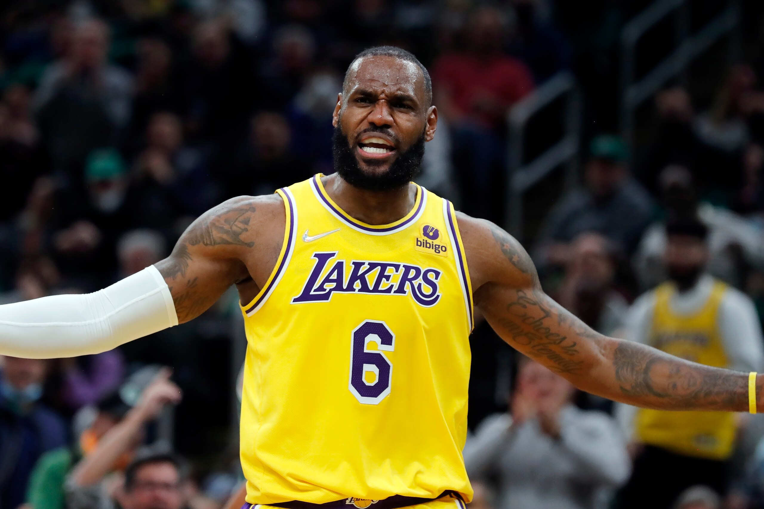 Los Angeles Lakers' LeBron James reacts to a call during the first half of an NBA basketball game against the Boston Celtics, Friday, Nov. 19, 2021, in Boston. (AP Photo/Michael Dwyer)