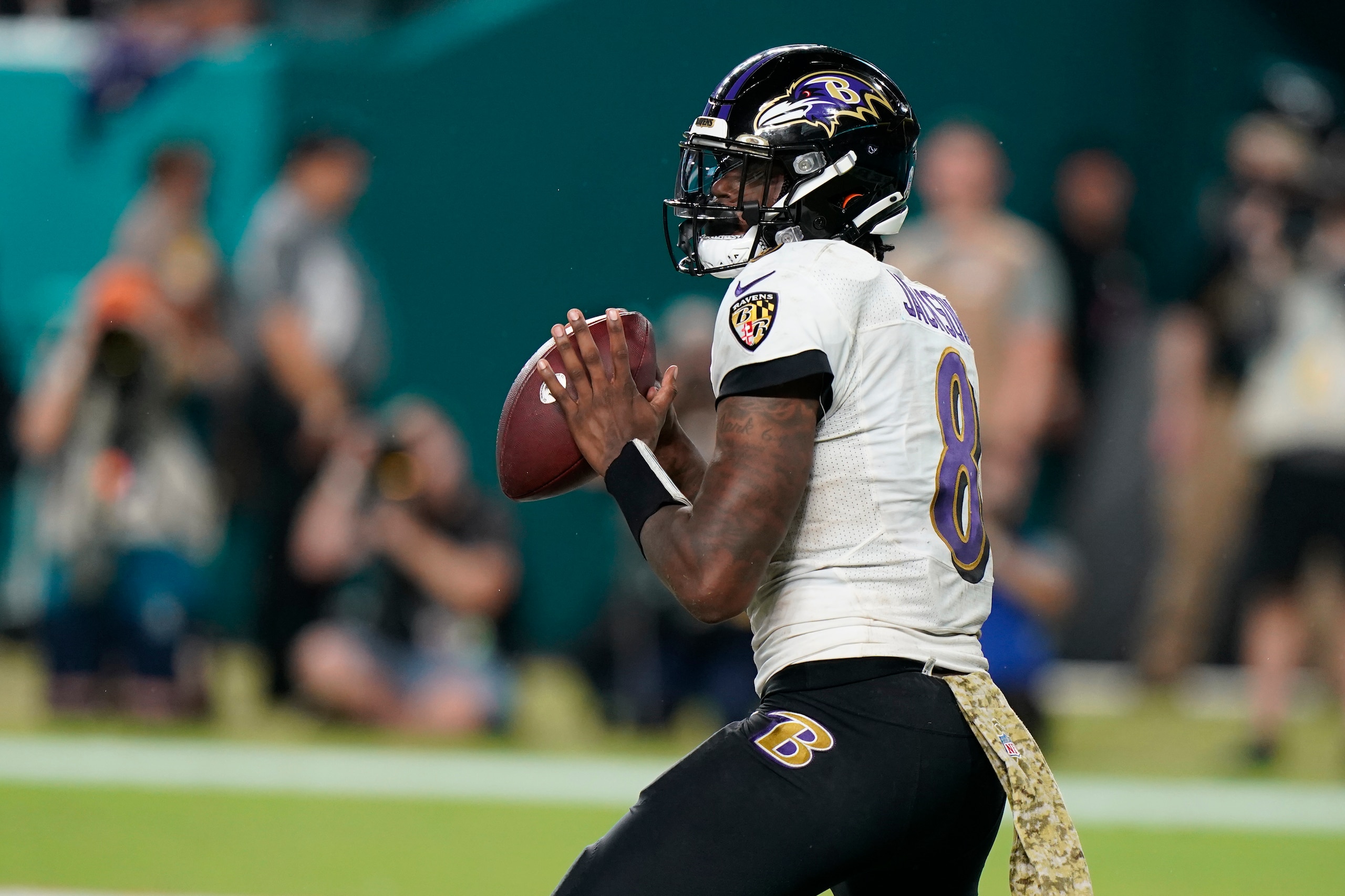 Baltimore Ravens quarterback Lamar Jackson (8) aims a pass during the second half of an NFL football game against the Miami Dolphins, Thursday, Nov. 11, 2021, in Miami Gardens, Fla. (AP Photo/Wilfredo Lee)