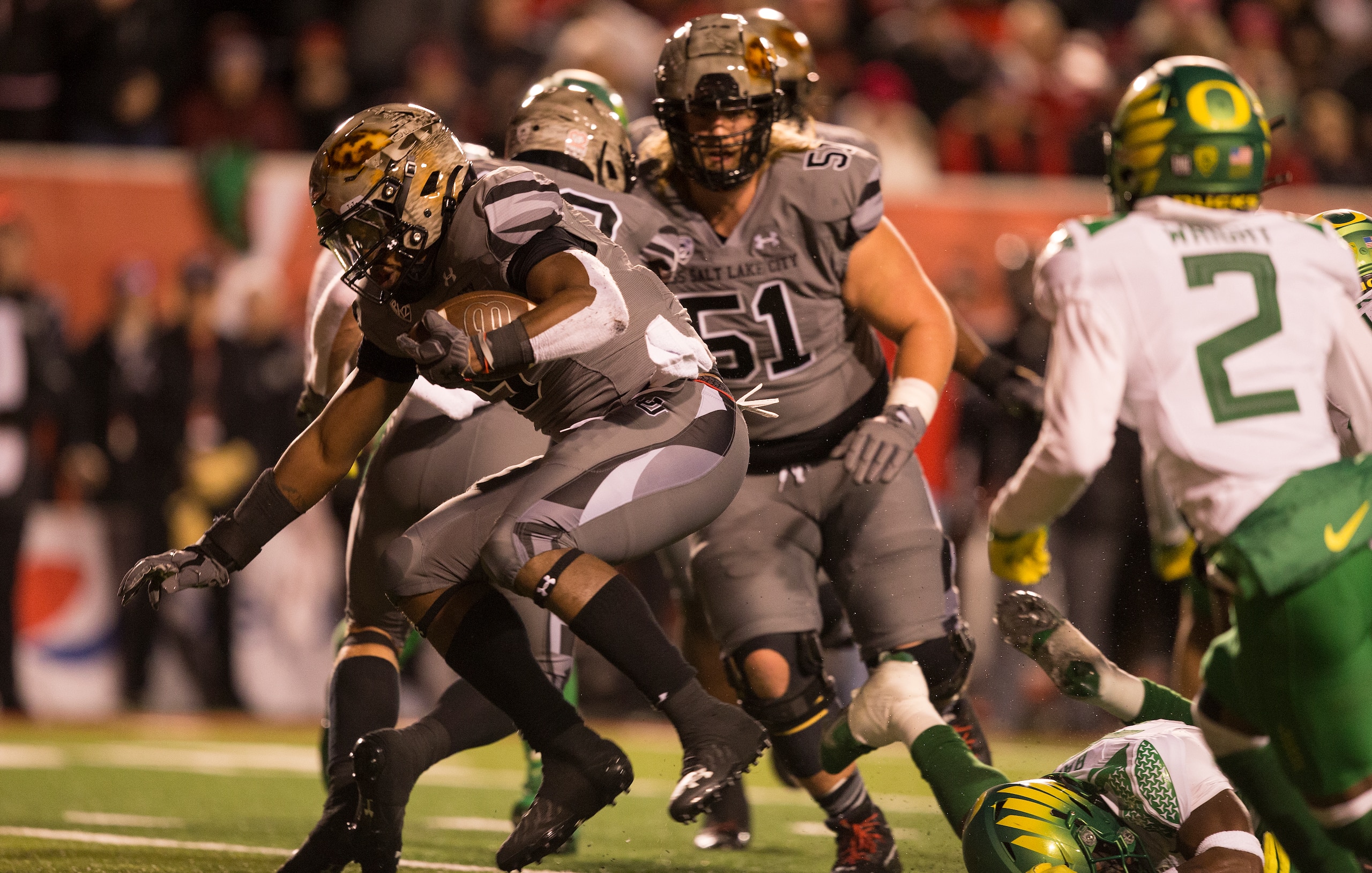 SALT LAKE CITY, UT -  NOVEMBER 20: Tavion Thomas #9 of the Utah Utes rushes for a touchdown against the Oregon Ducks during their game November 20, 2021 at Rice-Eccles Stadium in Salt Lake City , Utah. (Photo by Chris Gardner/Getty Images)