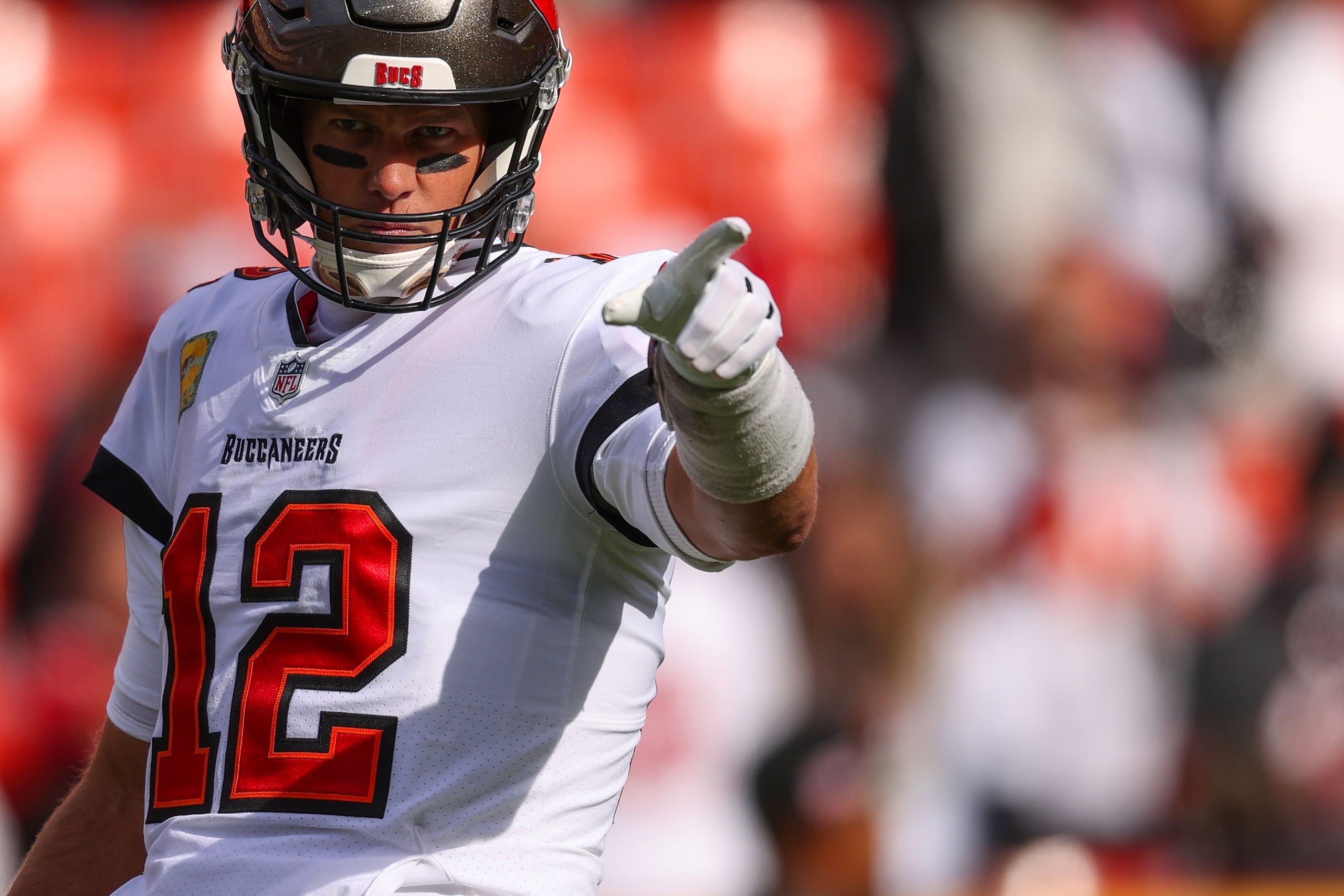 LANDOVER, MARYLAND - NOVEMBER 14: Quarterback Tom Brady #12 of the Tampa Bay Buccaneers looks on before playing against the Washington Football Team at FedExField on November 14, 2021 in Landover, Maryland. (Photo by Patrick Smith/Getty Images)