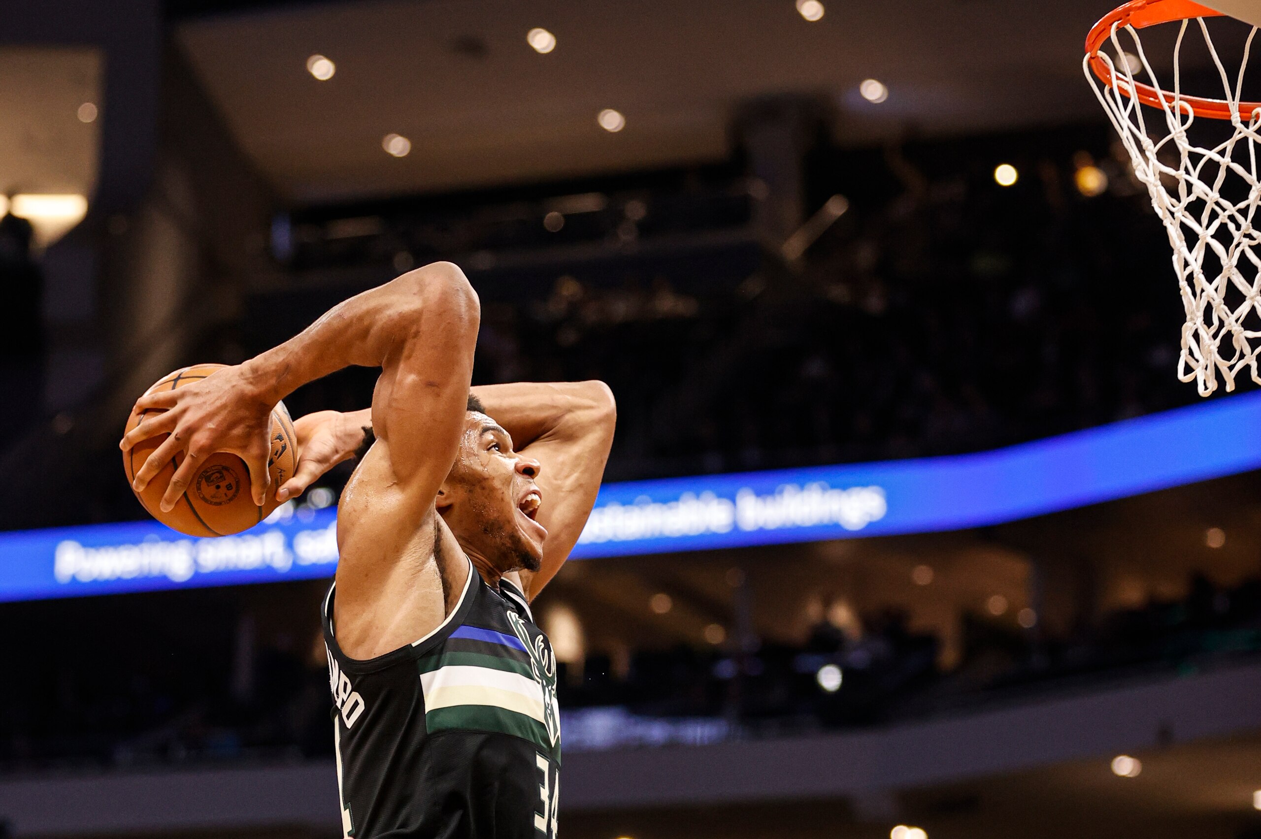 Milwaukee Bucks forward Giannis Antetokounmpo (34) dunks against the Orlando Magic during the first half of an NBA basketball game Saturday, Nov. 20, 2021, in Milwaukee. (AP Photo/Jeffrey Phelps)