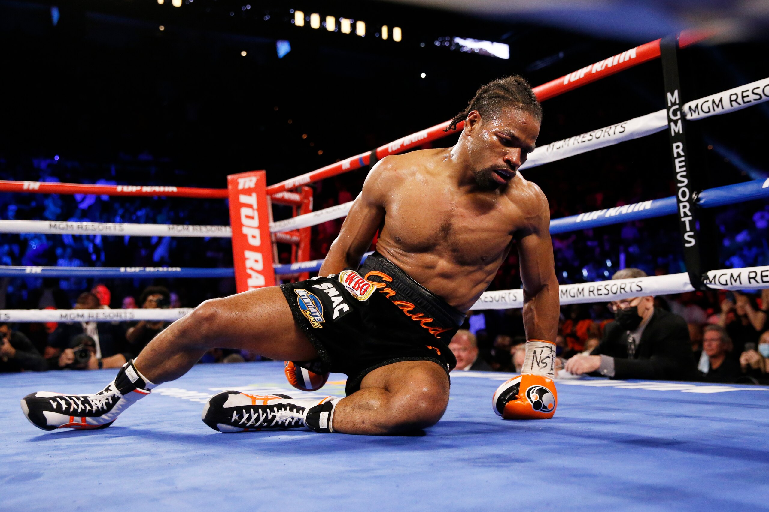Shawn Porter lies on the mat after he was knocked down by Terence Crawford during a welterweight title boxing match Saturday, Nov. 20, 2021, in Las Vegas. (AP Photo/Chase Stevens)