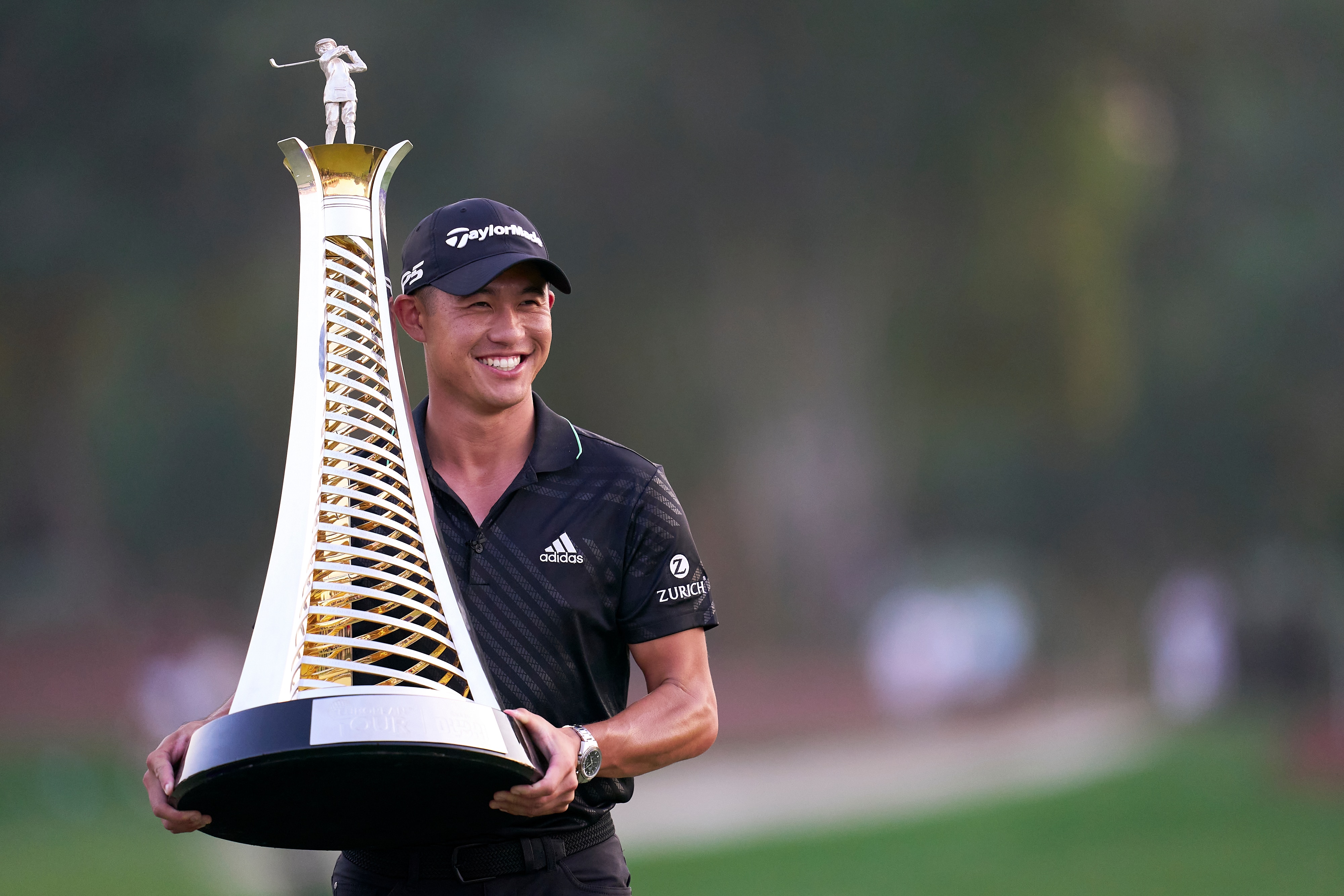 DUBAI, UNITED ARAB EMIRATES - NOVEMBER 21: Collin Morikawa of The United States poses with the Race to Dubai trophy during Day Four of The DP World Tour Championship at Jumeirah Golf Estates on November 21, 2021 in Dubai, United Arab Emirates. (Photo by Pedro Salado/Quality Sport Images/Getty Images)