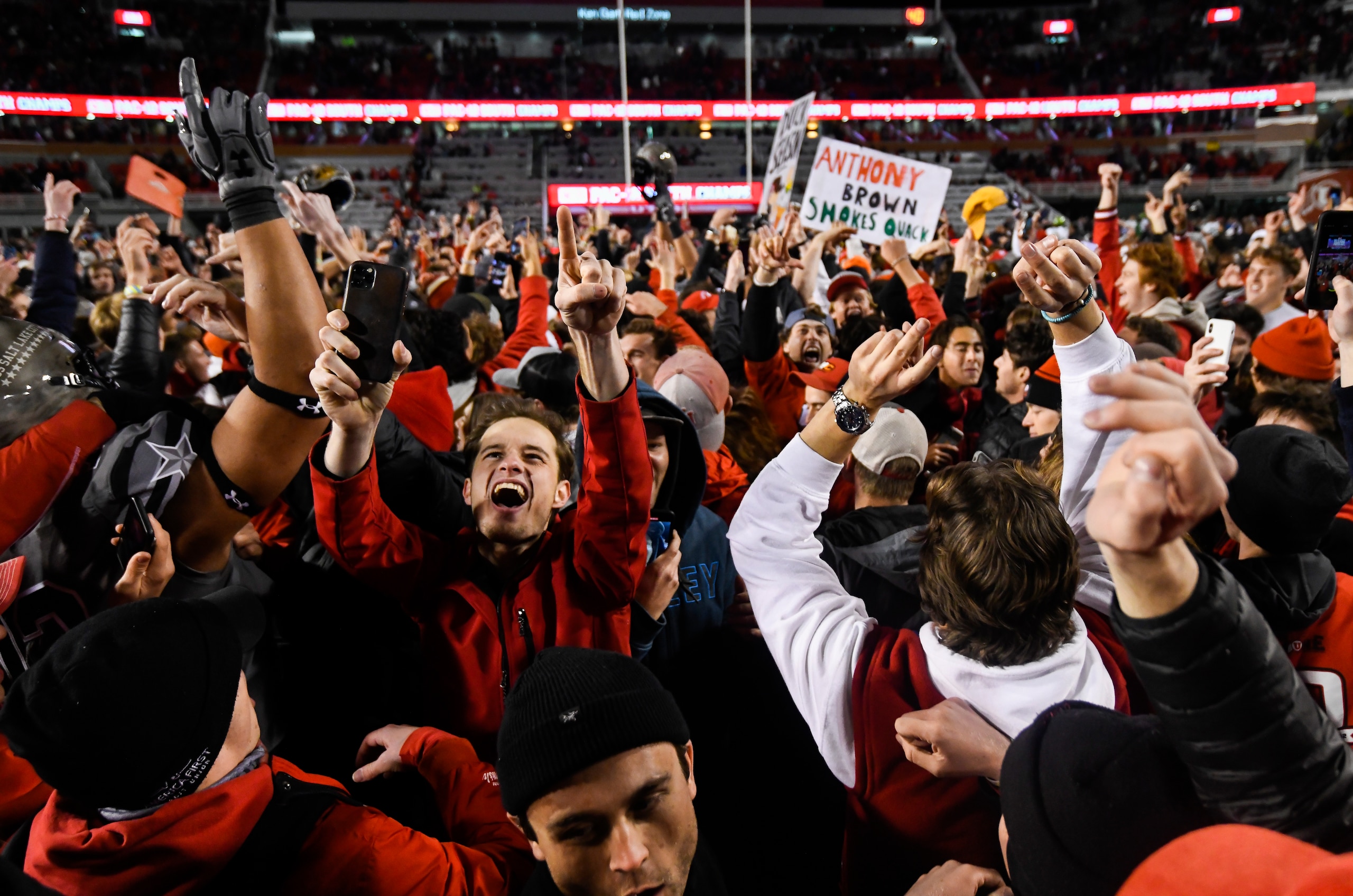 Utah fans rush the field after an NCAA college football game against Oregon, Saturday, Nov. 20, 2021, in Salt Lake City. (AP Photo/Alex Goodlett)