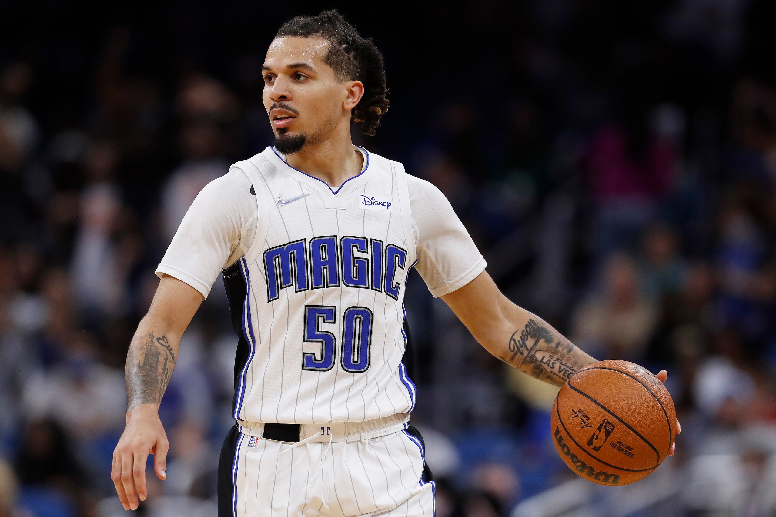 ORLANDO, FLORIDA - NOVEMBER 13: Cole Anthony #50 of the Orlando Magic dribbles against the Washington Wizards during the second half at Amway Center on November 13, 2021 in Orlando, Florida. NOTE TO USER: User expressly acknowledges and agrees that, by downloading and or using this photograph, User is consenting to the terms and conditions of the Getty Images License Agreement. (Photo by Michael Reaves/Getty Images) ORLANDO, FLORIDA - NOVEMBER 13: Cole Anthony #50 of the Orlando Magic dribbles against the Washington Wizards during the second half at Amway Center on November 13, 2021 in Orlando, Florida. NOTE TO USER: User expressly acknowledges and agrees that, by downloading and or using this photograph, User is consenting to the terms and conditions of the Getty Images License Agreement. (Photo by Michael Reaves/Getty Images)