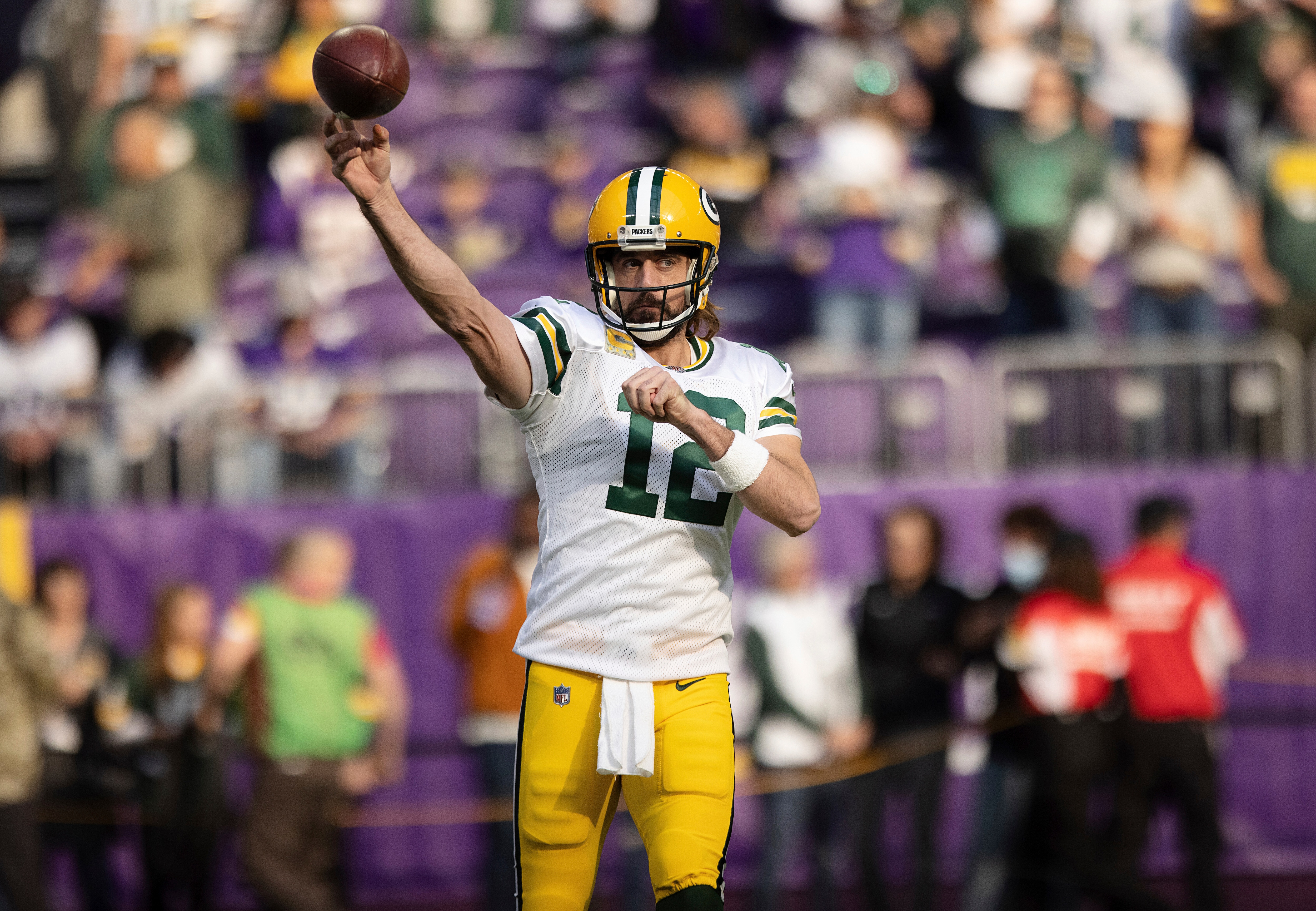 Green Bay Packers quarterback Aaron Rodgers (12) warms up prior to an NFL football game against the Minnesota Vikings, Sunday, Nov. 21, 2021 in Minneapolis. (AP Photo/Stacy Bengs)