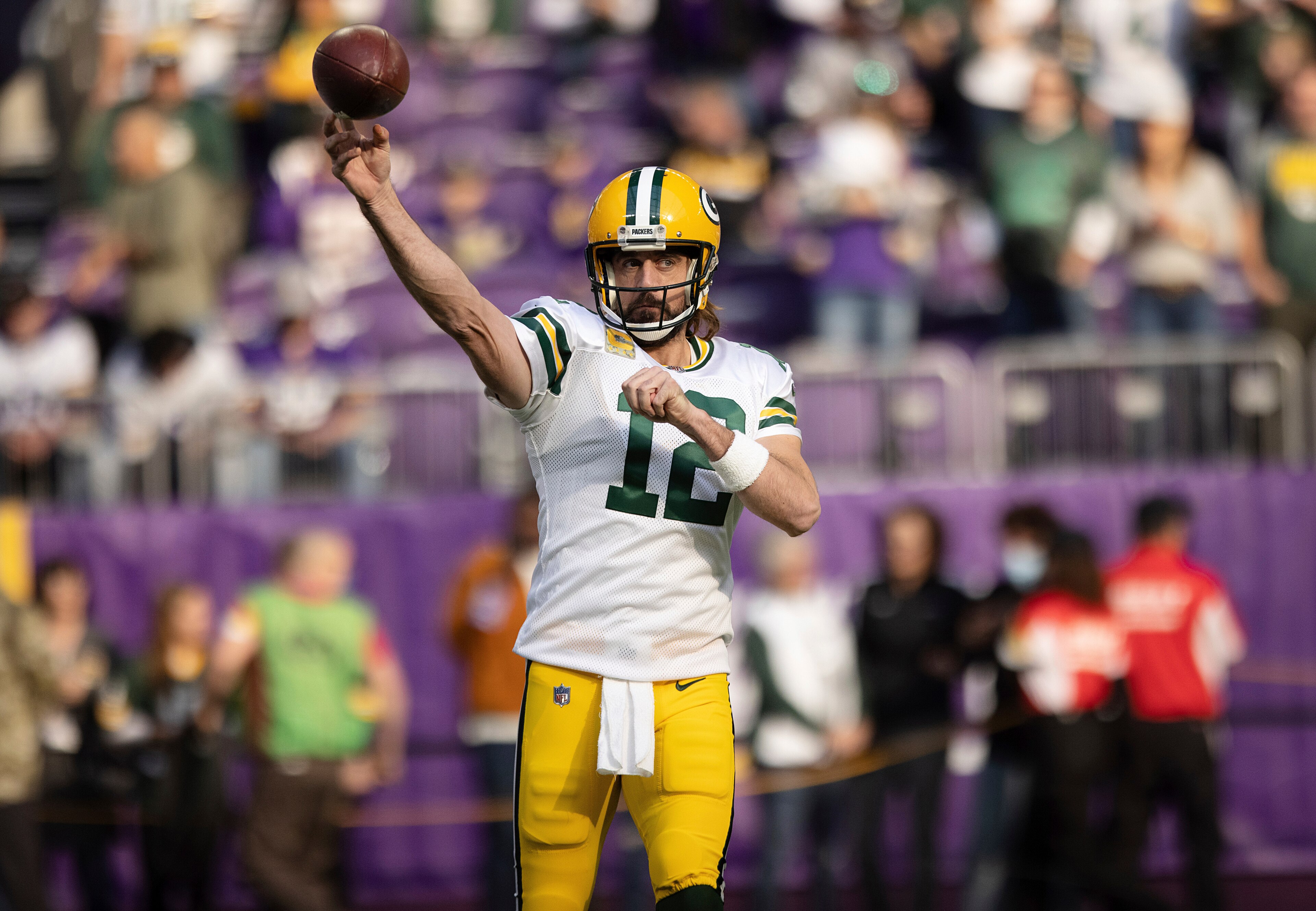 Green Bay Packers quarterback Aaron Rodgers (12) warms up prior to an NFL football game against the Minnesota Vikings, Sunday, Nov. 21, 2021 in Minneapolis. (AP Photo/Stacy Bengs)