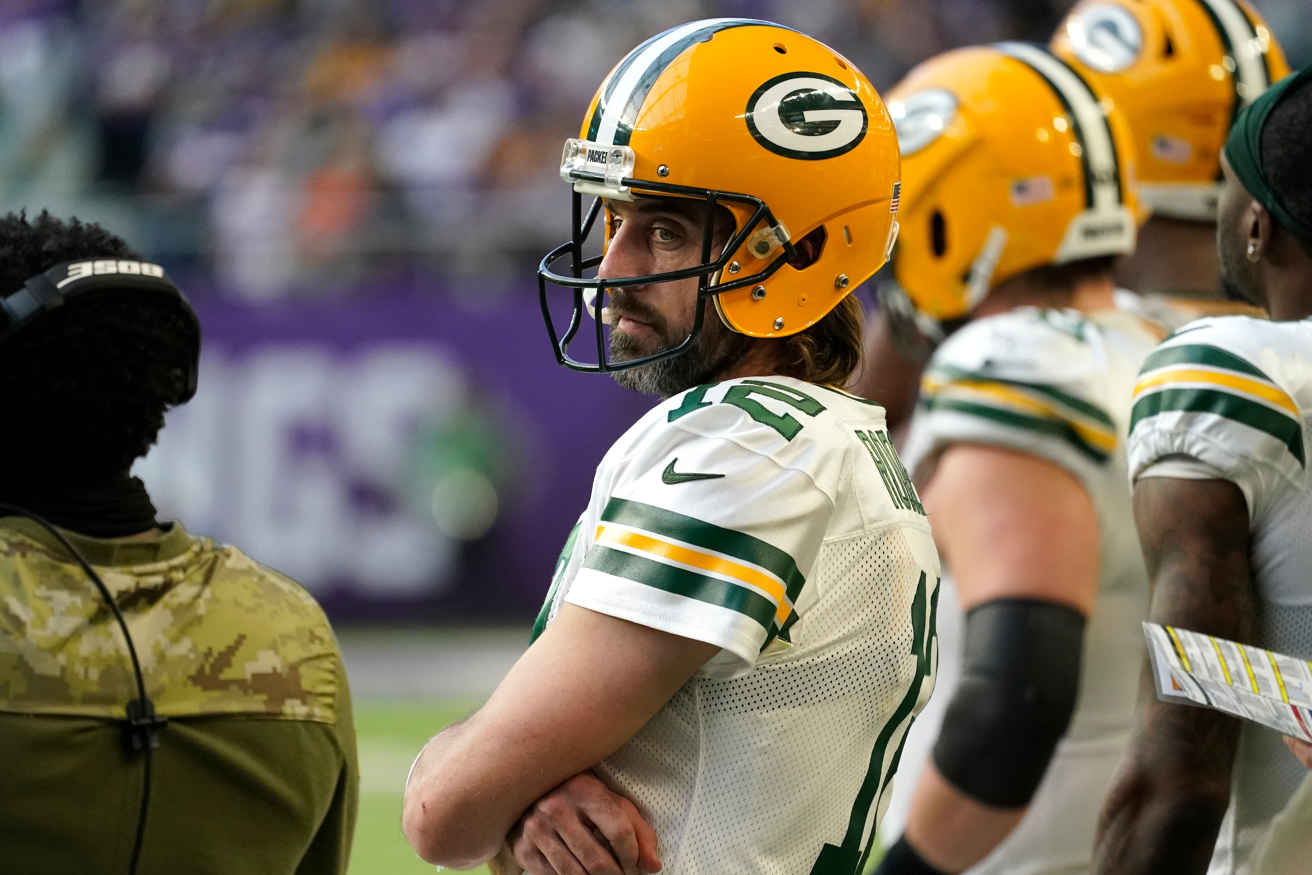 Green Bay Packers quarterback Aaron Rodgers (12) stands on the sideline during the second half of an NFL football game against the Minnesota Vikings, Sunday, Nov. 21, 2021, in Minneapolis. (AP Photo/Jim Mone)